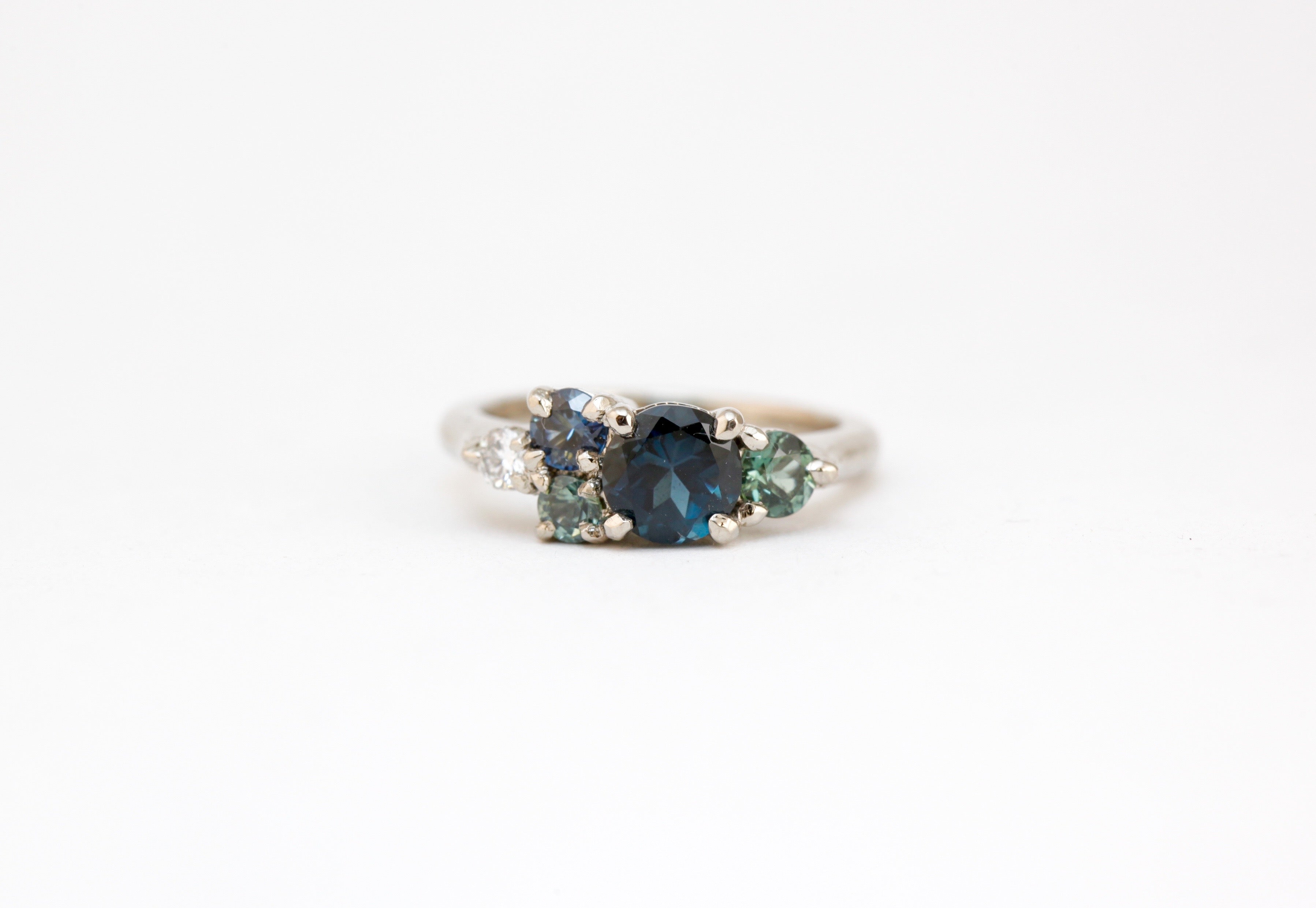 Melbourne made, ethically sourced sapphires in 18ct white gold bespoke cluster engagement ring