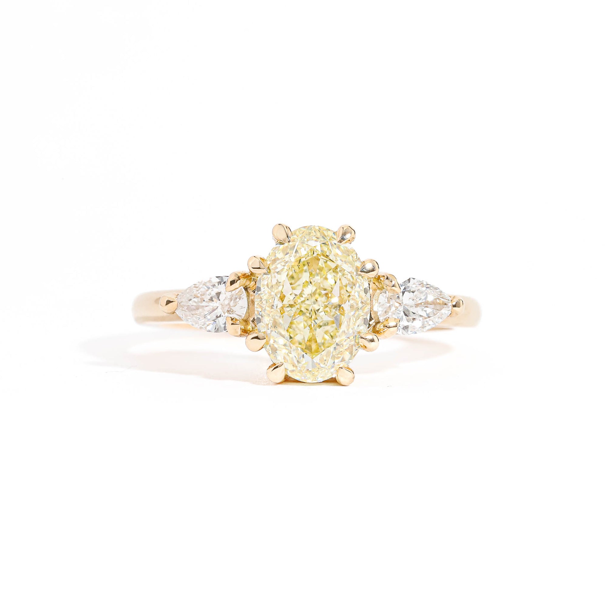 Oval Cut Diamond Ring with Pear Cut Diamond Ring in 18 Carat Yellow Gold