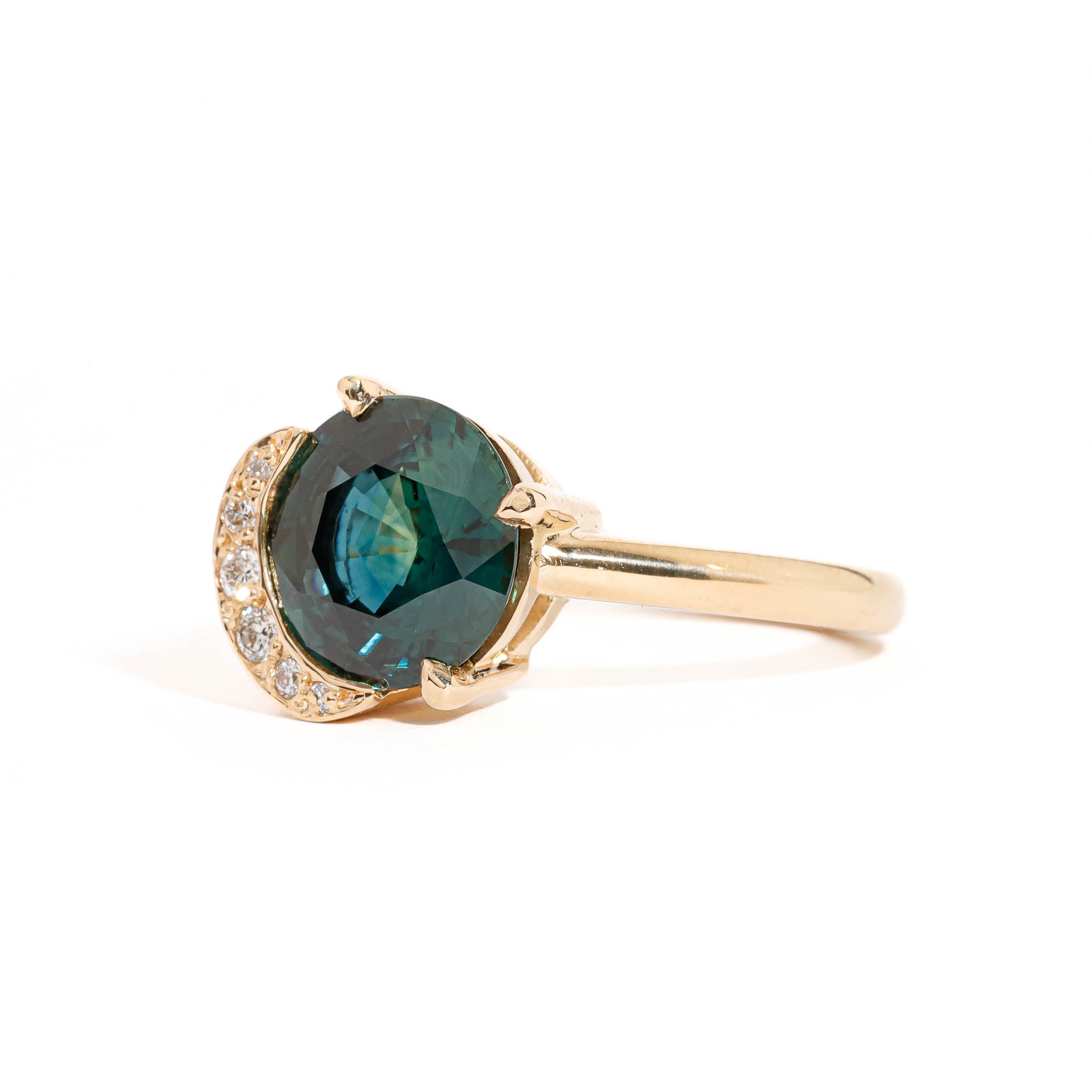 Round Brilliant Cut Teal Sapphire with Half Halo of White Diamonds in 18 Carat Yellow Gold