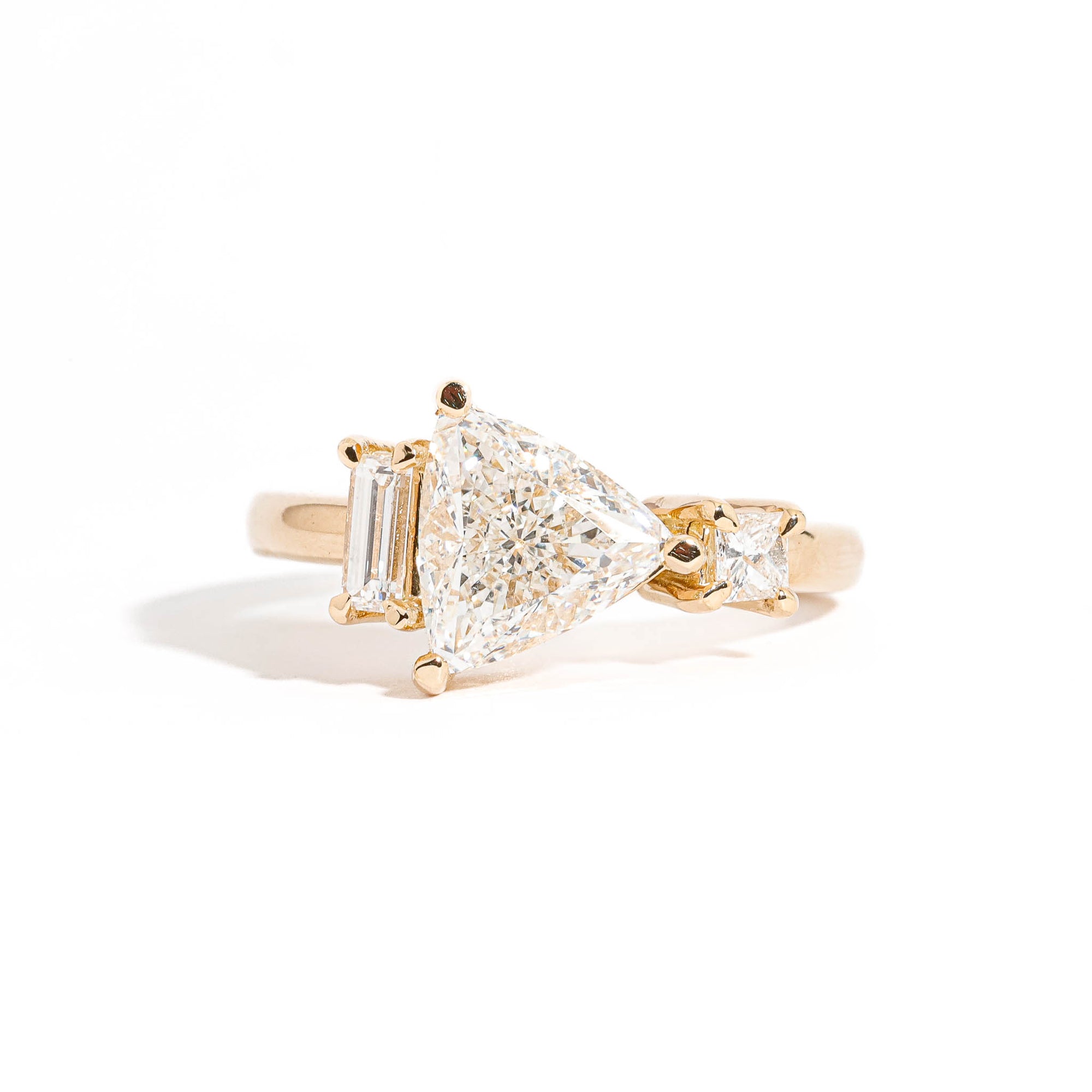 Trillion Cut Diamond Ring with Baguette and Princess Cut Diamond Side Stones in 18 Carat Yellow Gold