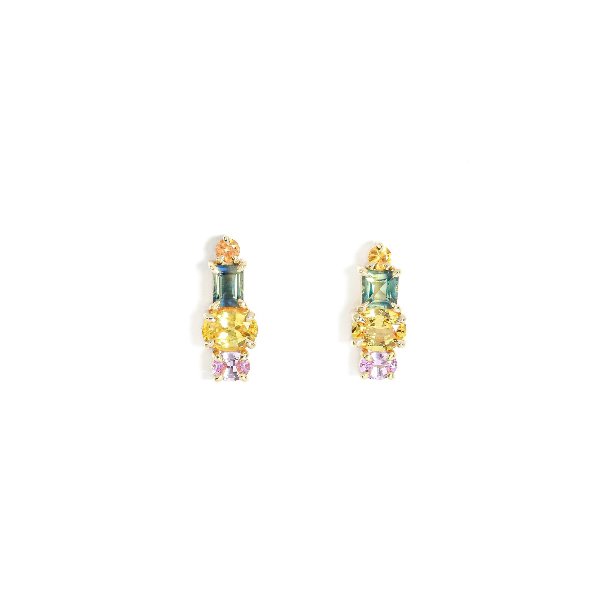 Pair of earrings with colorful gemstones on a white background