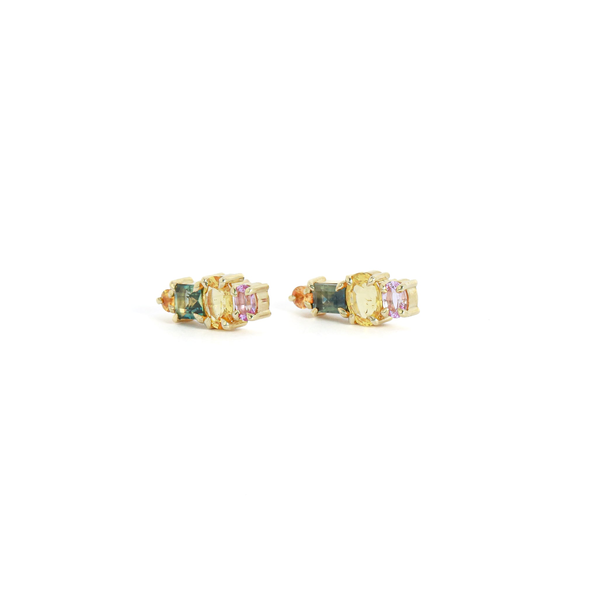 Pair of gold earrings with multicolored gemstones on a white background