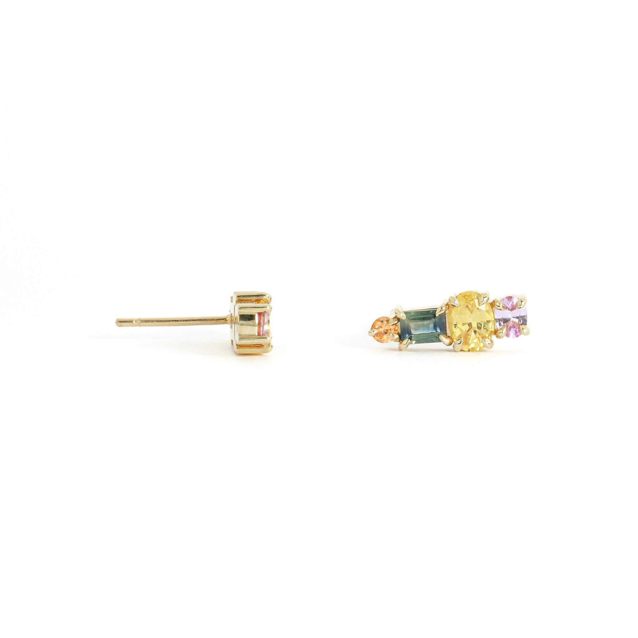 Gold stud earrings with multicolored gemstones on a white background