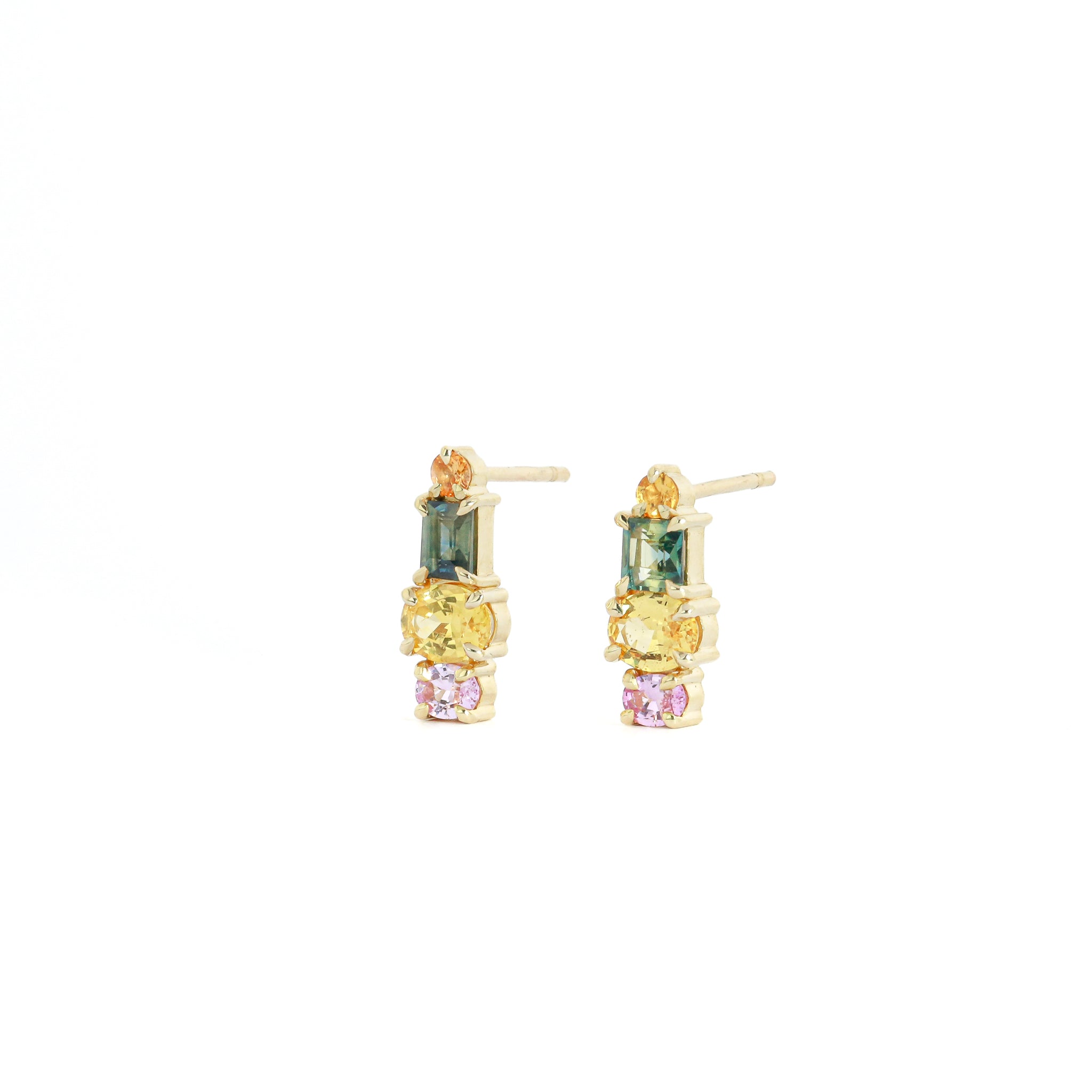 Pair of gold earrings with multicolored gemstones on a white background