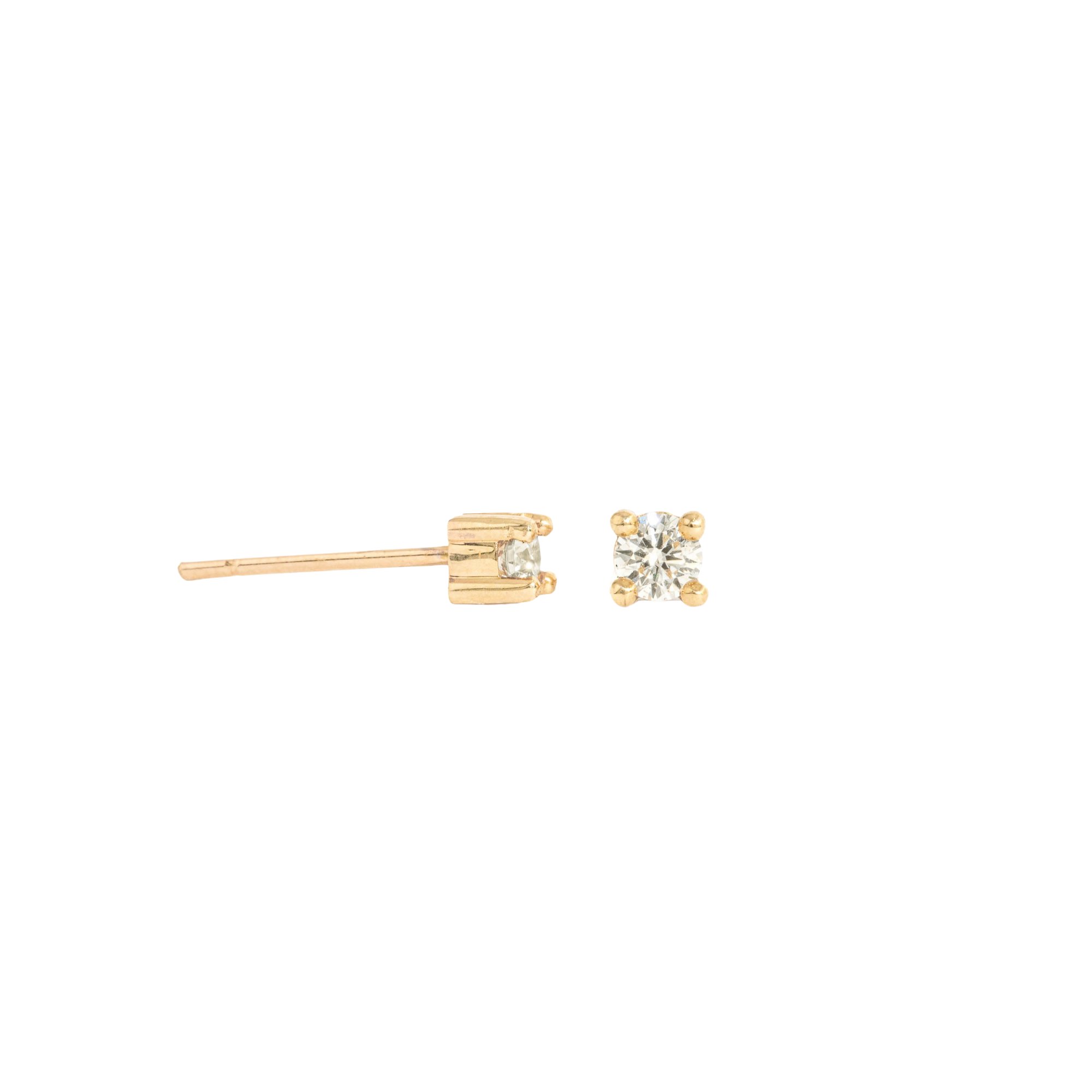 pair of white diamond stud earrings in yellow gold