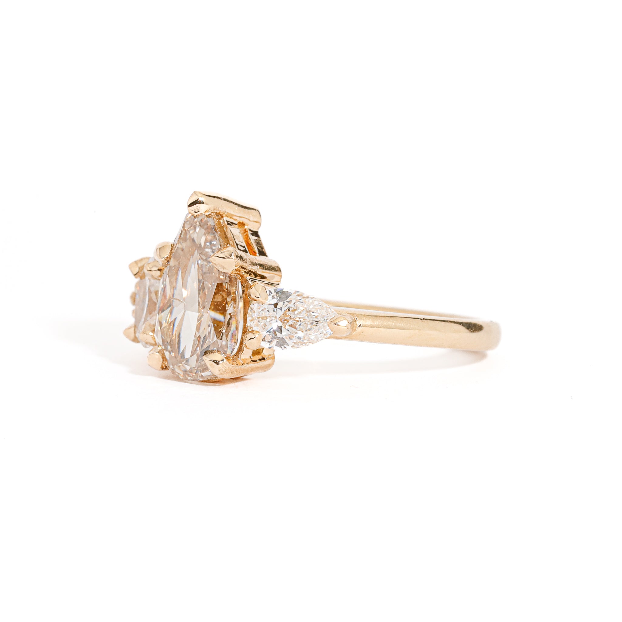 Pear Cut Champagne Diamond with Pear and Round Brilliant Cut White Diamond Side Stones in 18 Carat Yellow Gold