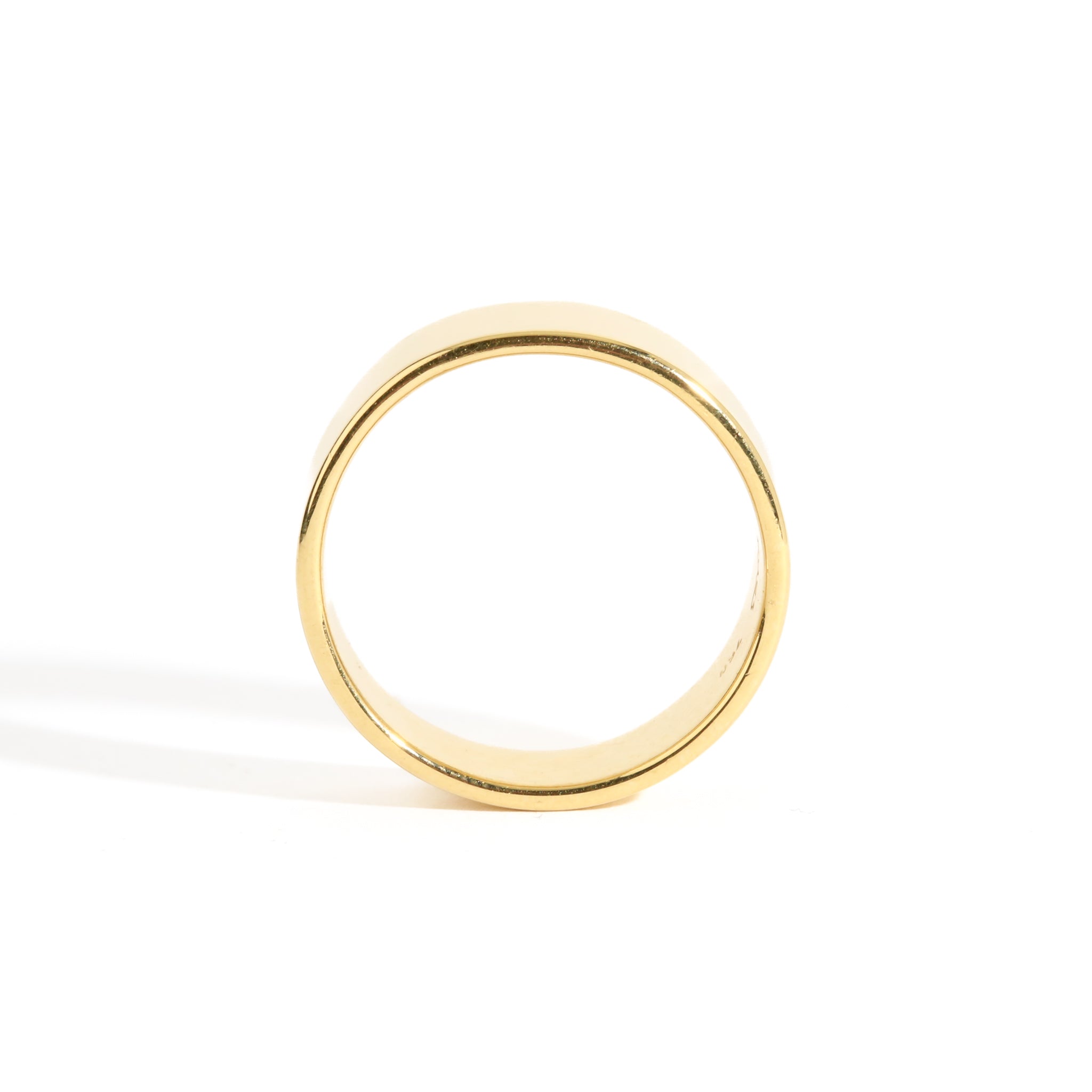 Handmade cigar wedding band, shown in 18 carat yellow gold.
