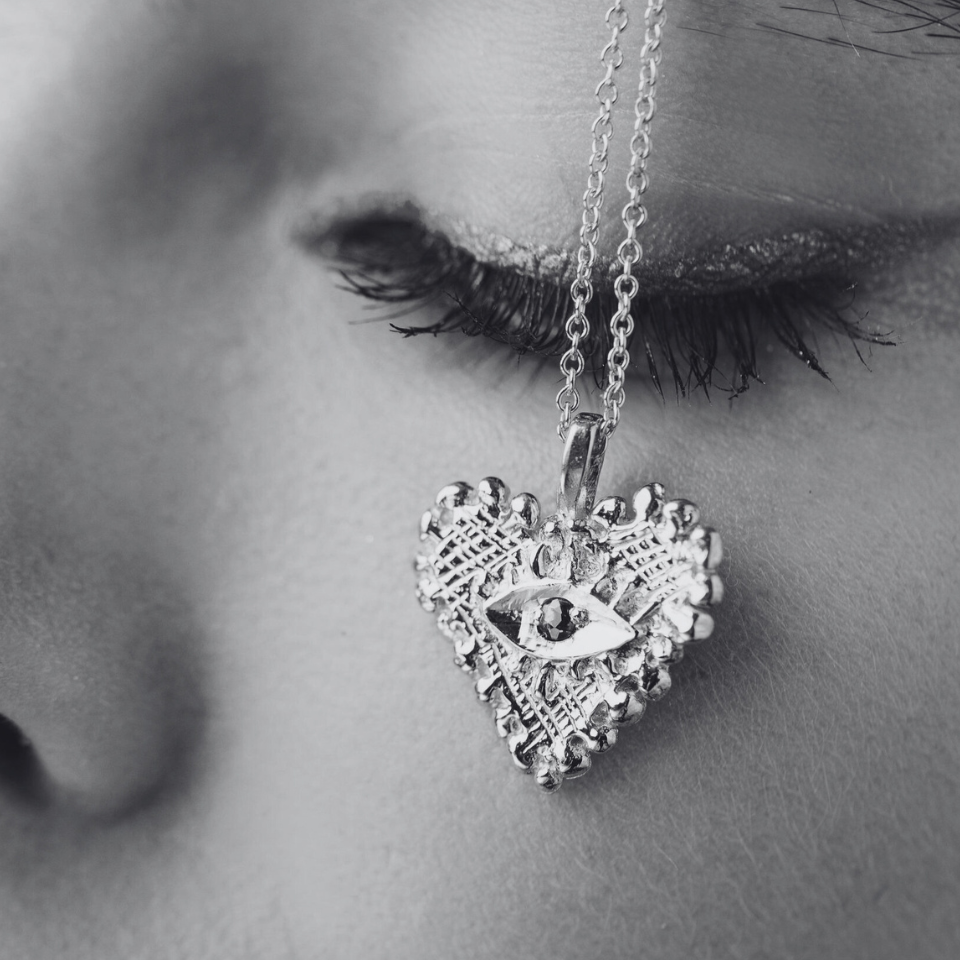 HEART PENDANT ON FACE CLOSE UP