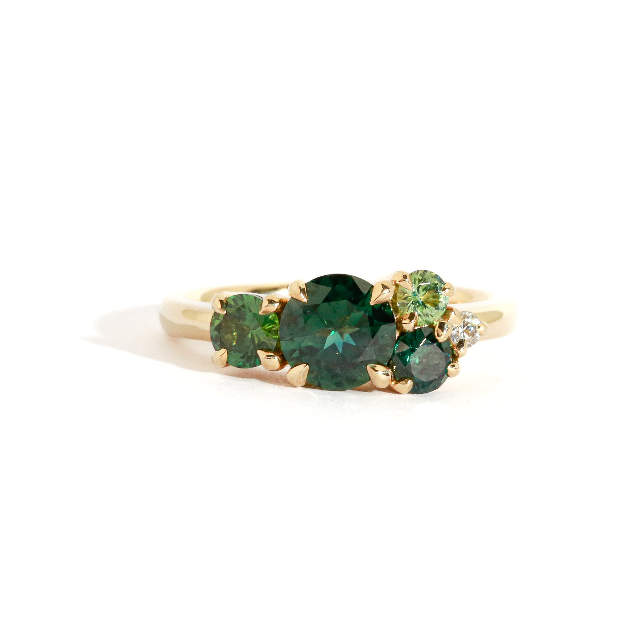 green sapphire cluster engagement ring