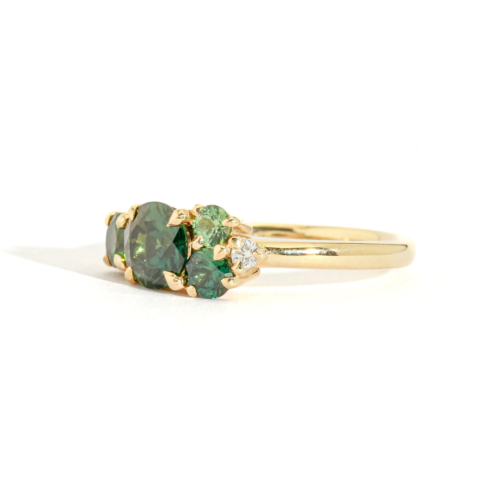 green sapphire and diamond cluster ring