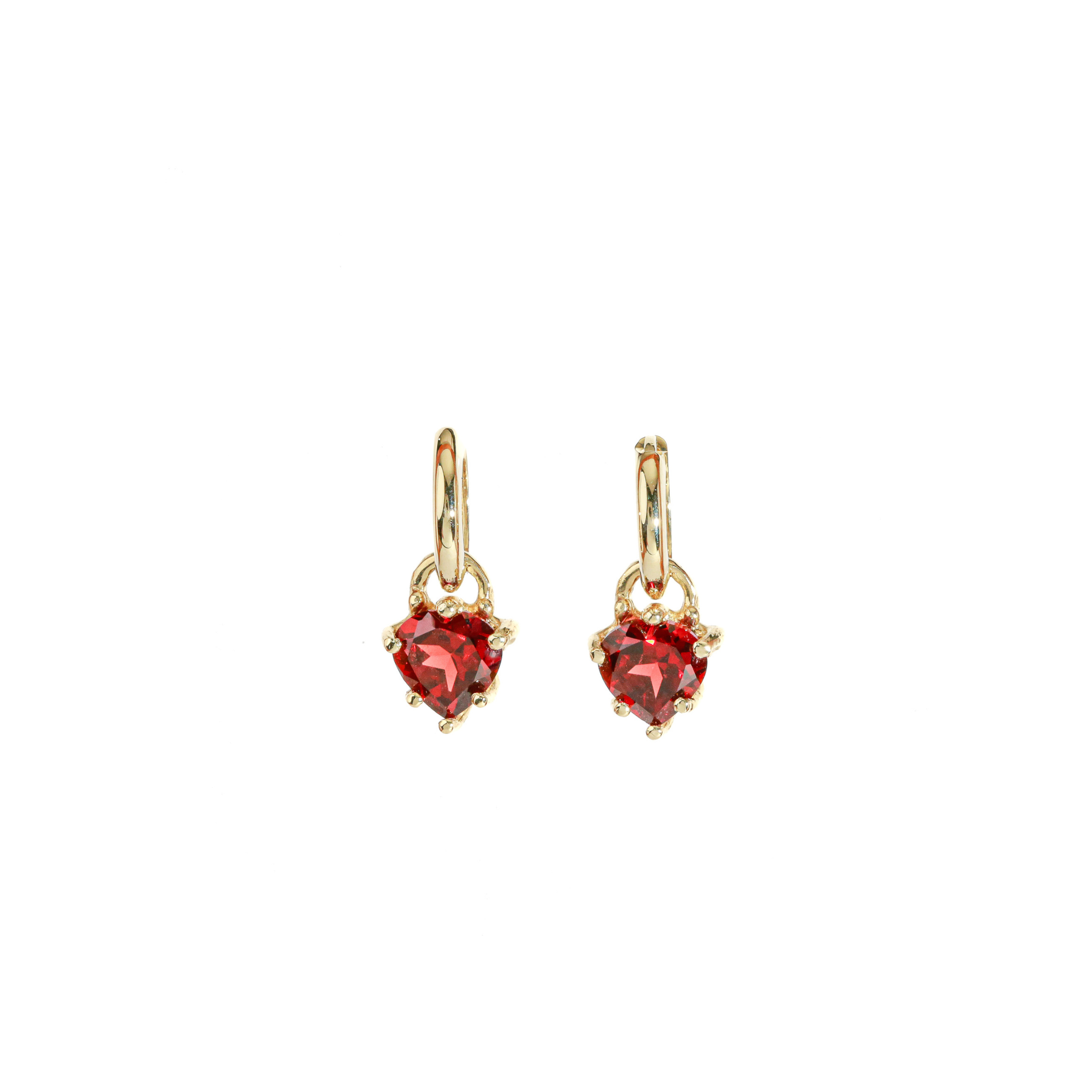 Gold hoop earrings with red heart-shaped garnet on a white background