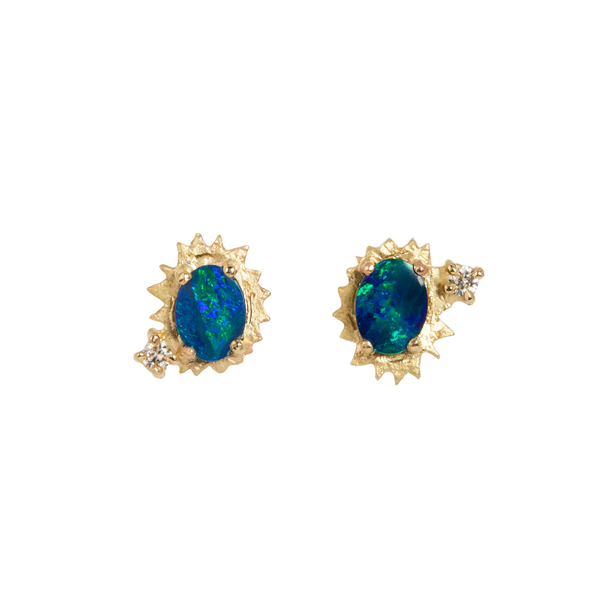 A pair of gold-toned stud earrings featuring oval blue-green opal centers surrounded by a starburst-like gold setting, with small clear accent stones on the sides, shown on a plain white background.