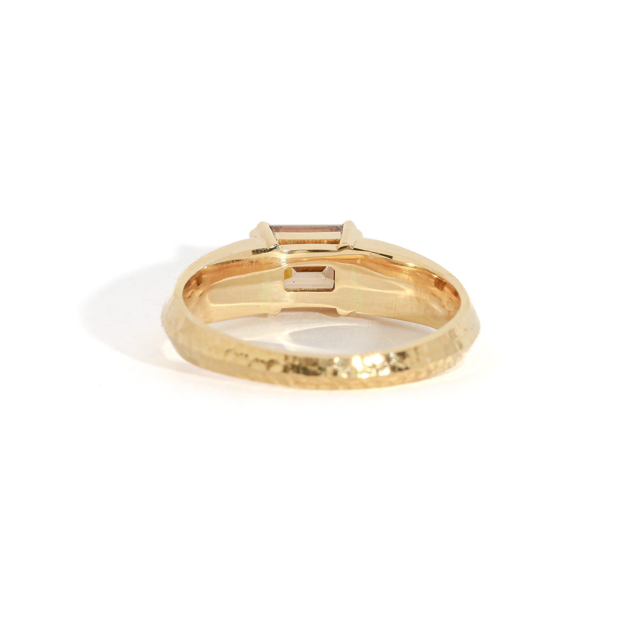 Gold ring on a white background