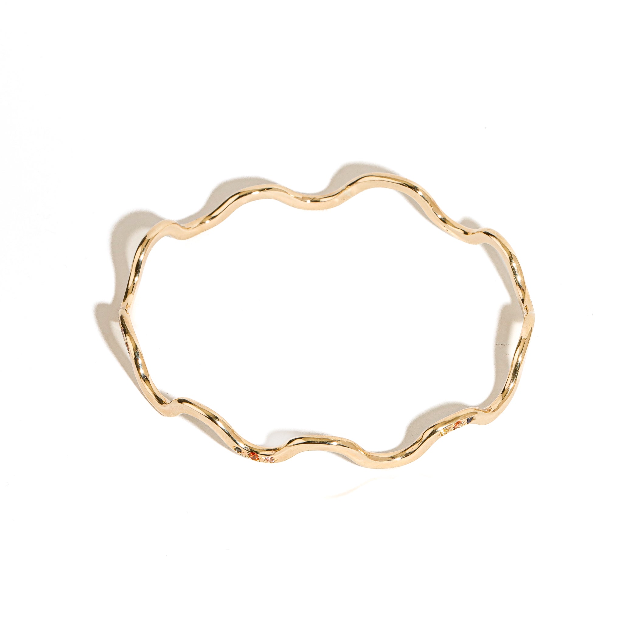 9 carat yellow gold wavy bangle clusters mixed coloured sapphires