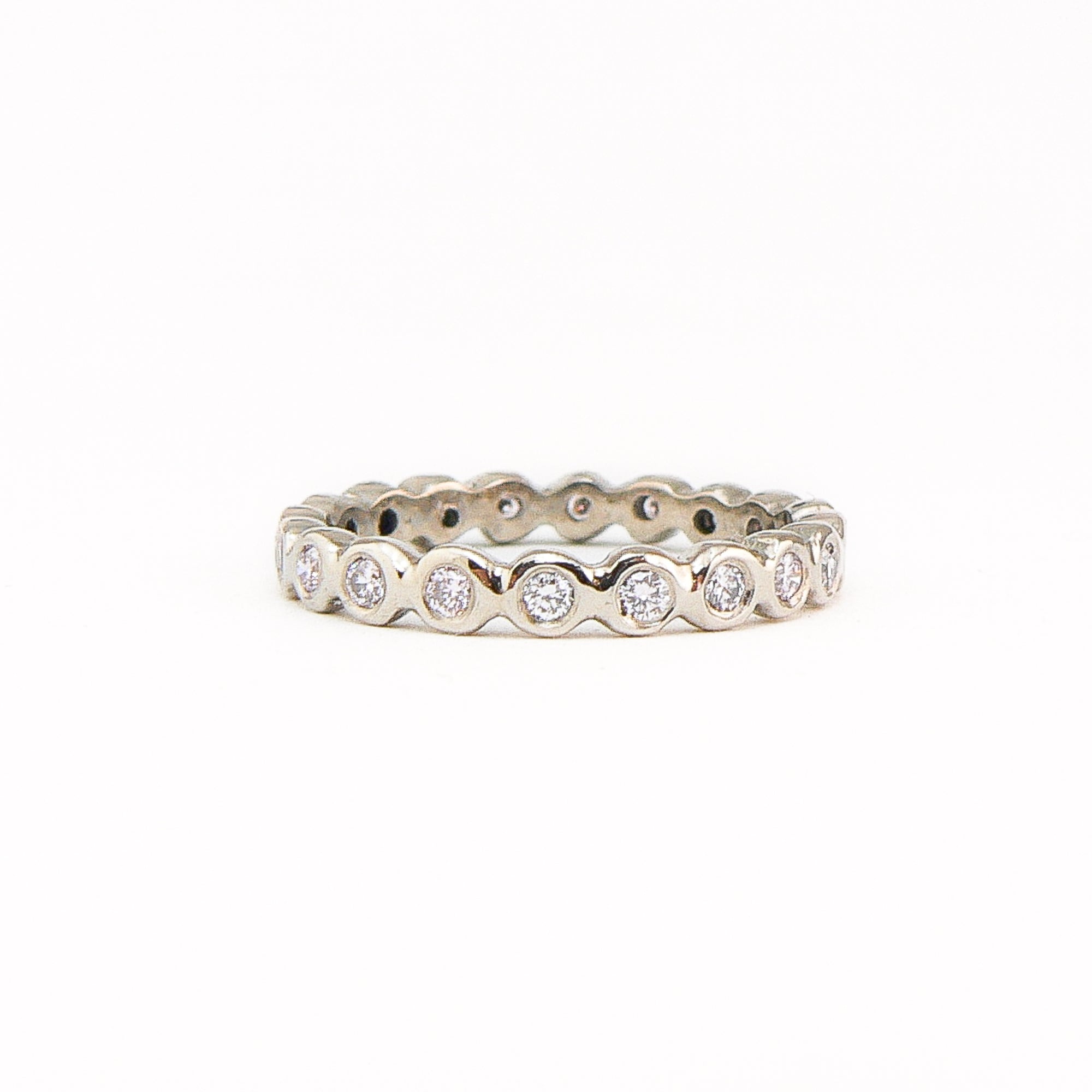 Bespoke 18 carat white gold eternity ring, set with 23 round brilliant cut white diamonds.