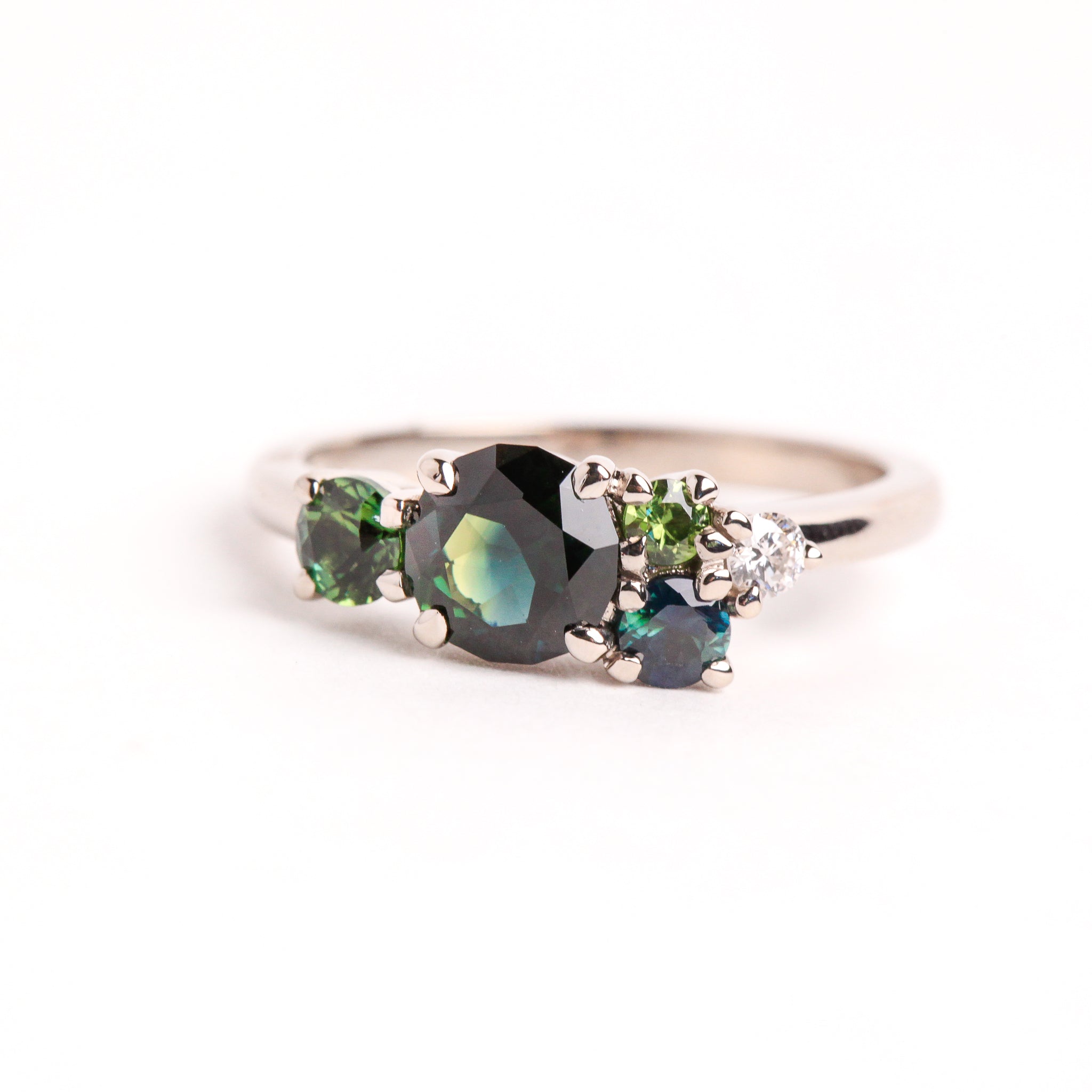 white gold green sapphire cluster engagement ring