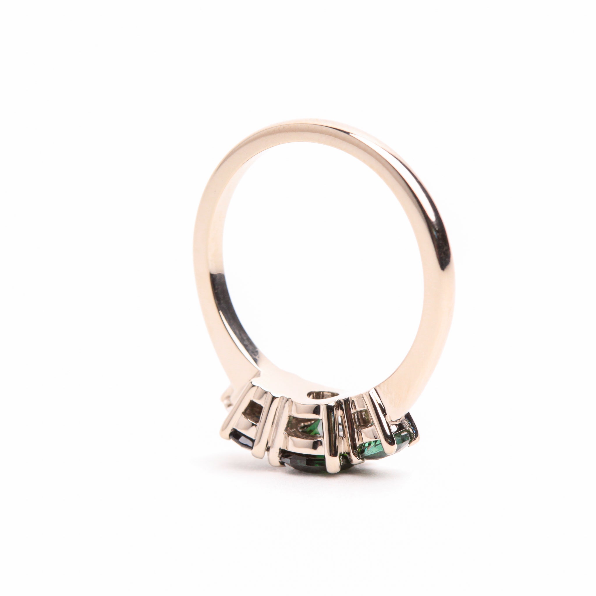 custom white gold engagement ring designed with cluster of sapphires