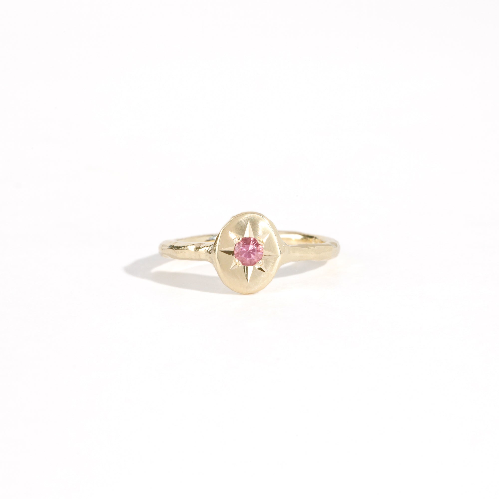 9ct yellow gold signet ring with star set pink sapphire in centre. Bespoke and handmade in Melbourne by Black Finch Jewellery