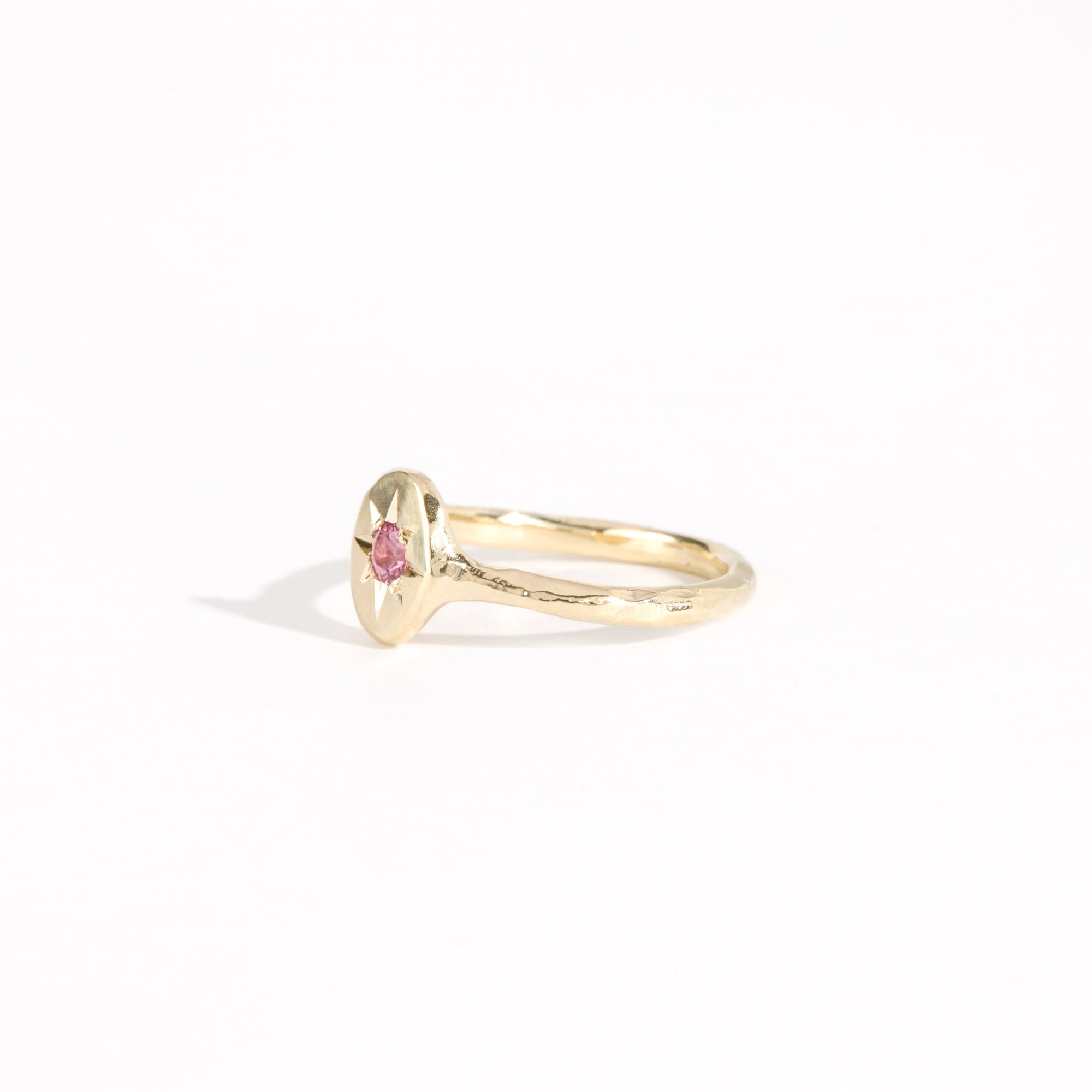 9ct yellow gold signet ring with star set pink sapphire in centre. Bespoke and handmade in Melbourne by Black Finch Jewellery