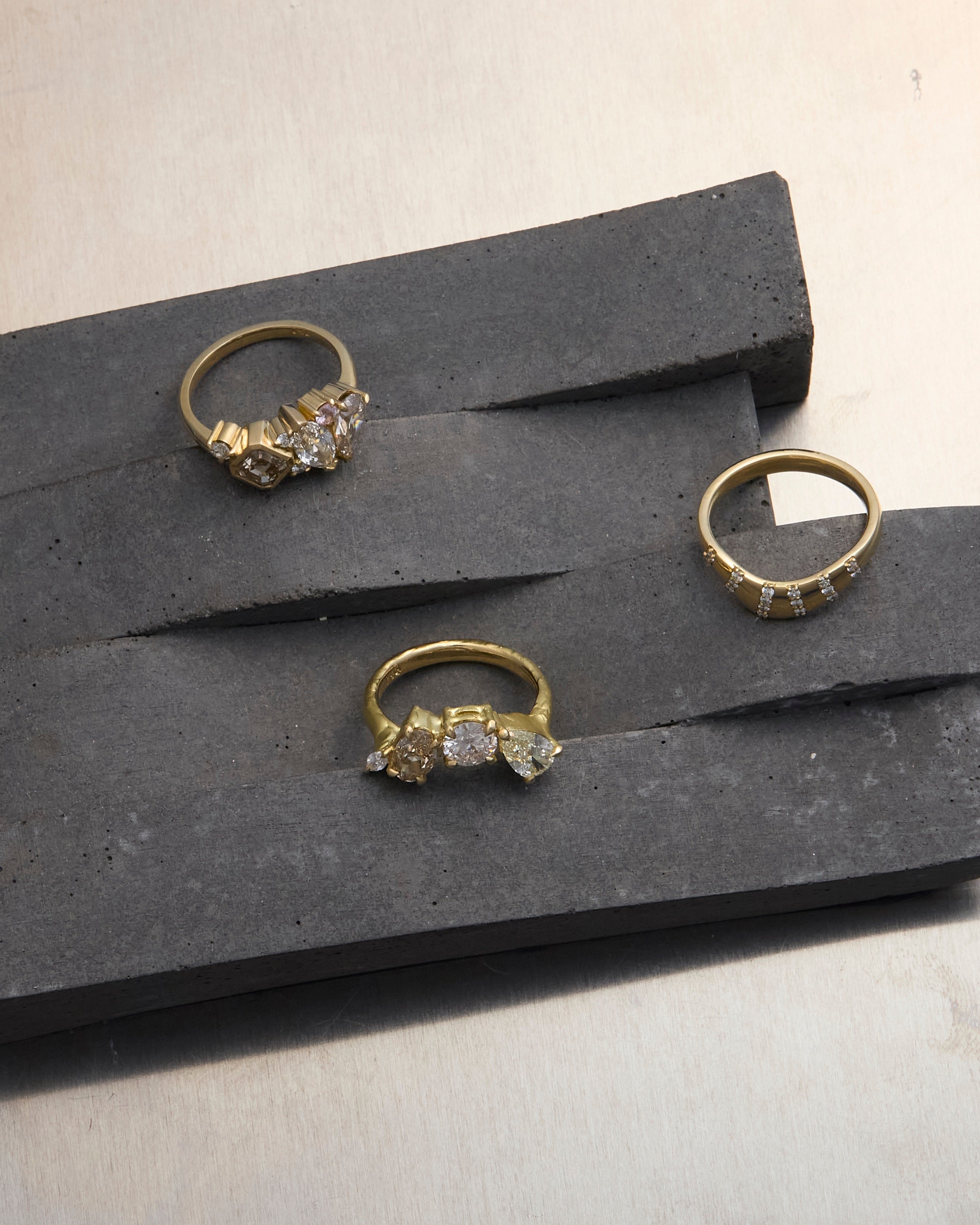 gold rings on a granite rock display