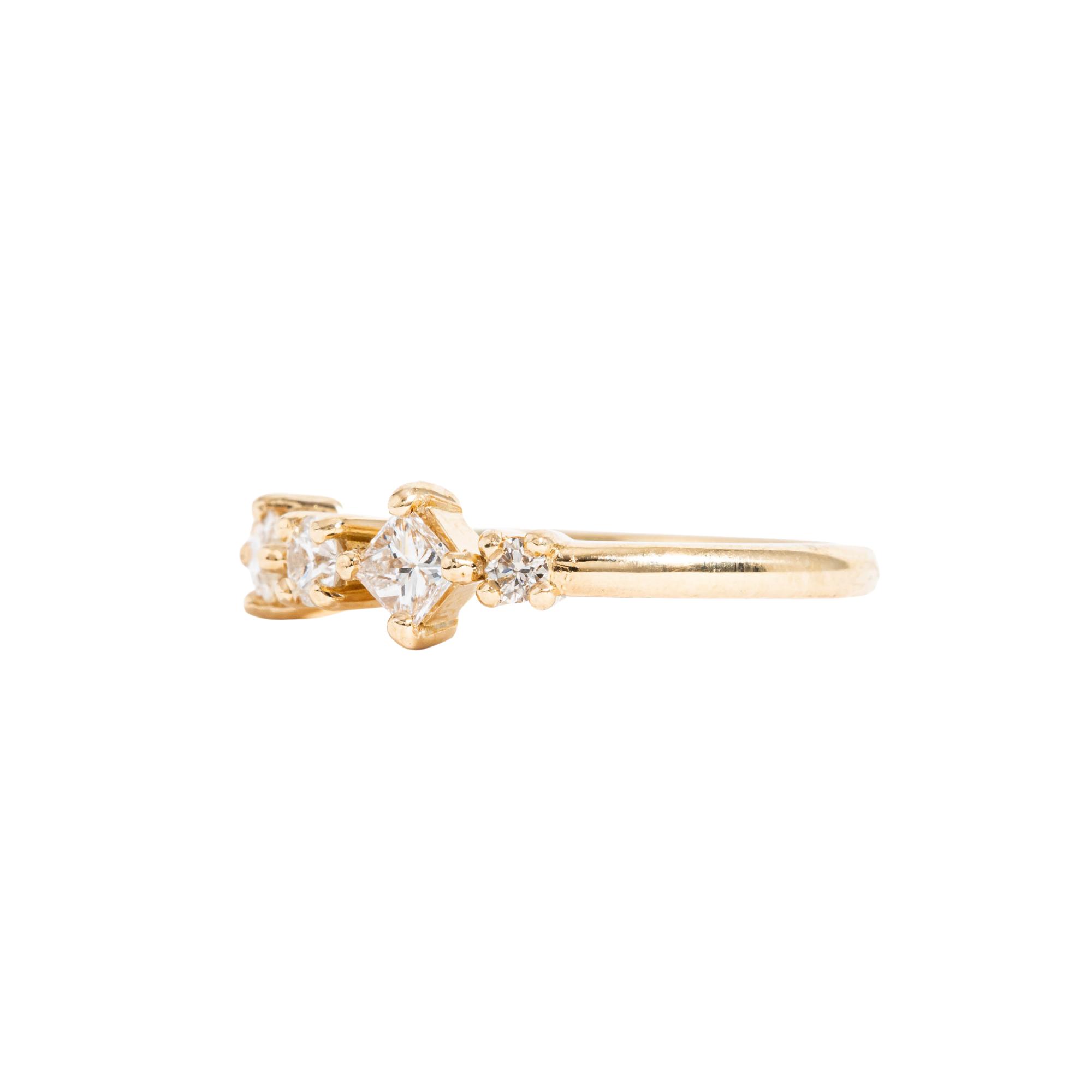 Gold ring with diamonds on a white background