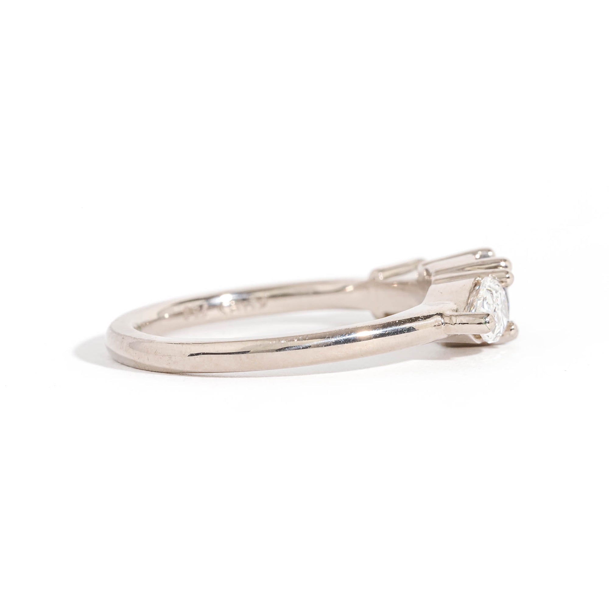 Three Stone Ring with Centre Blue Sapphire, Round White Diamond and Tapered Blue Baguette Sapphire Side Stones in 18 Carat White Gold