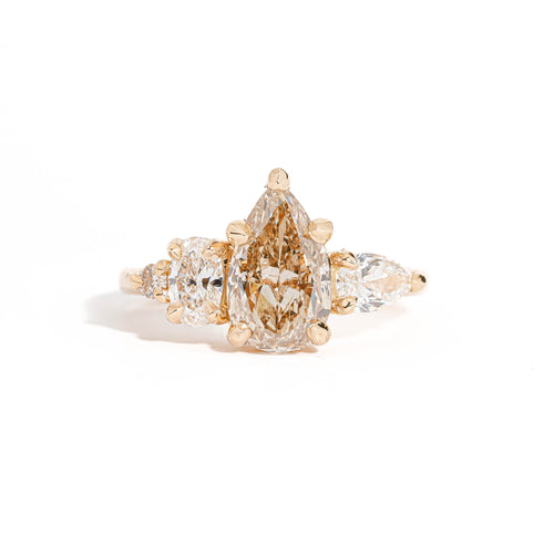 Pear Cut Champagne Diamond with Pear and Round Brilliant Cut White Diamond Side Stones in 18 Carat Yellow Gold 