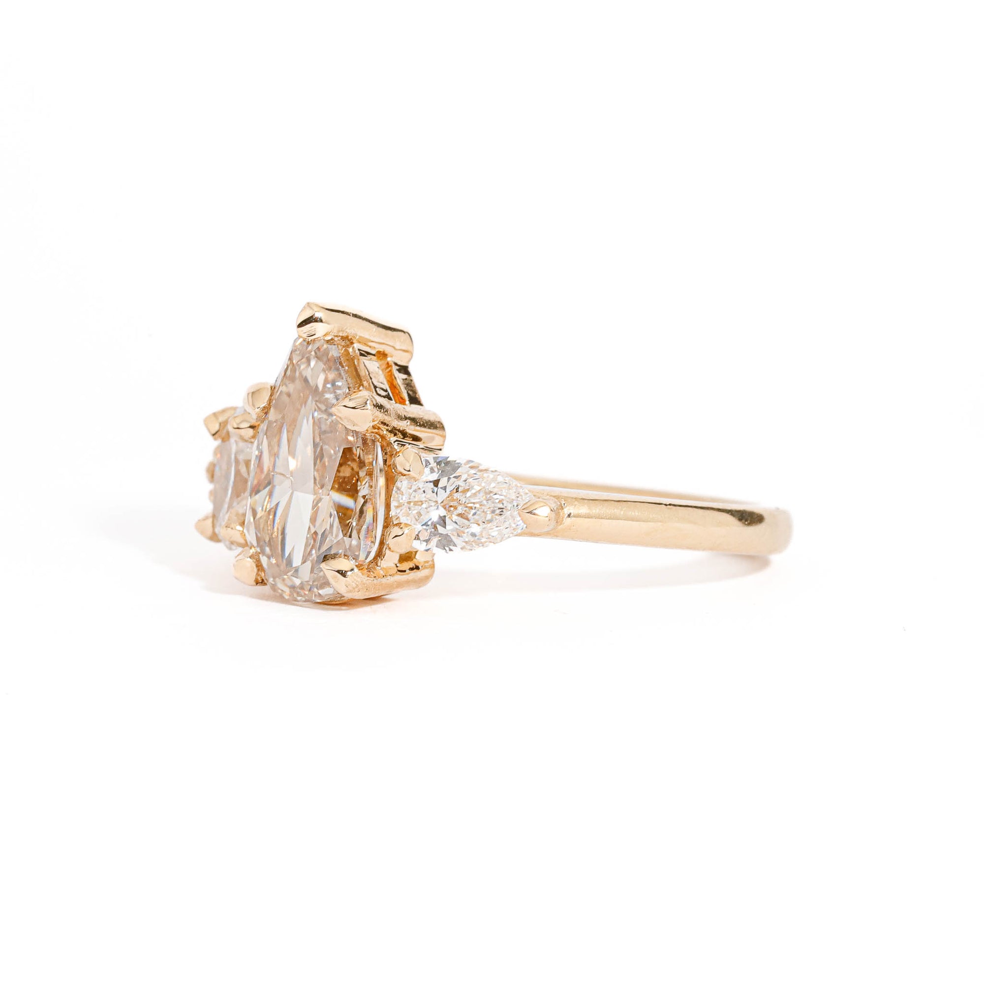 Pear Cut Champagne Diamond with Pear and Round Brilliant Cut White Diamond Side Stones in 18 Carat Yellow Gold 