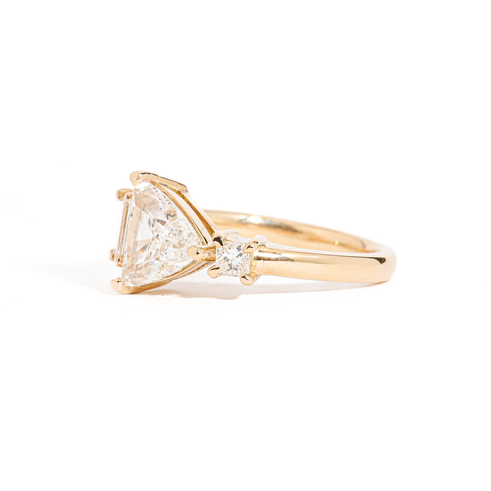 Trillion Cut Diamond Ring with Baguette and Princess Cut Diamond Side Stones in 18 Carat Yellow Gold