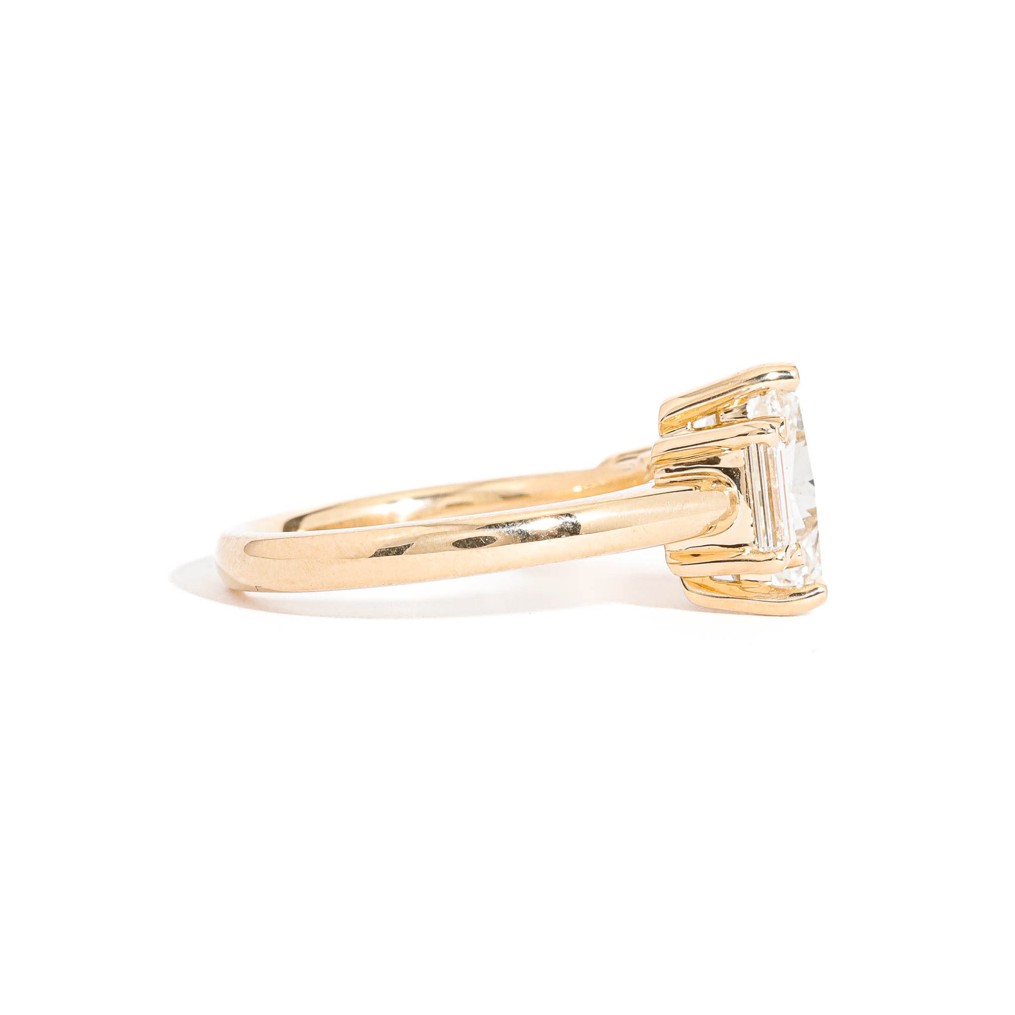 Trillion Cut Diamond Ring with Baguette and Princess Cut Diamond Side Stones in 18 Carat Yellow Gold
