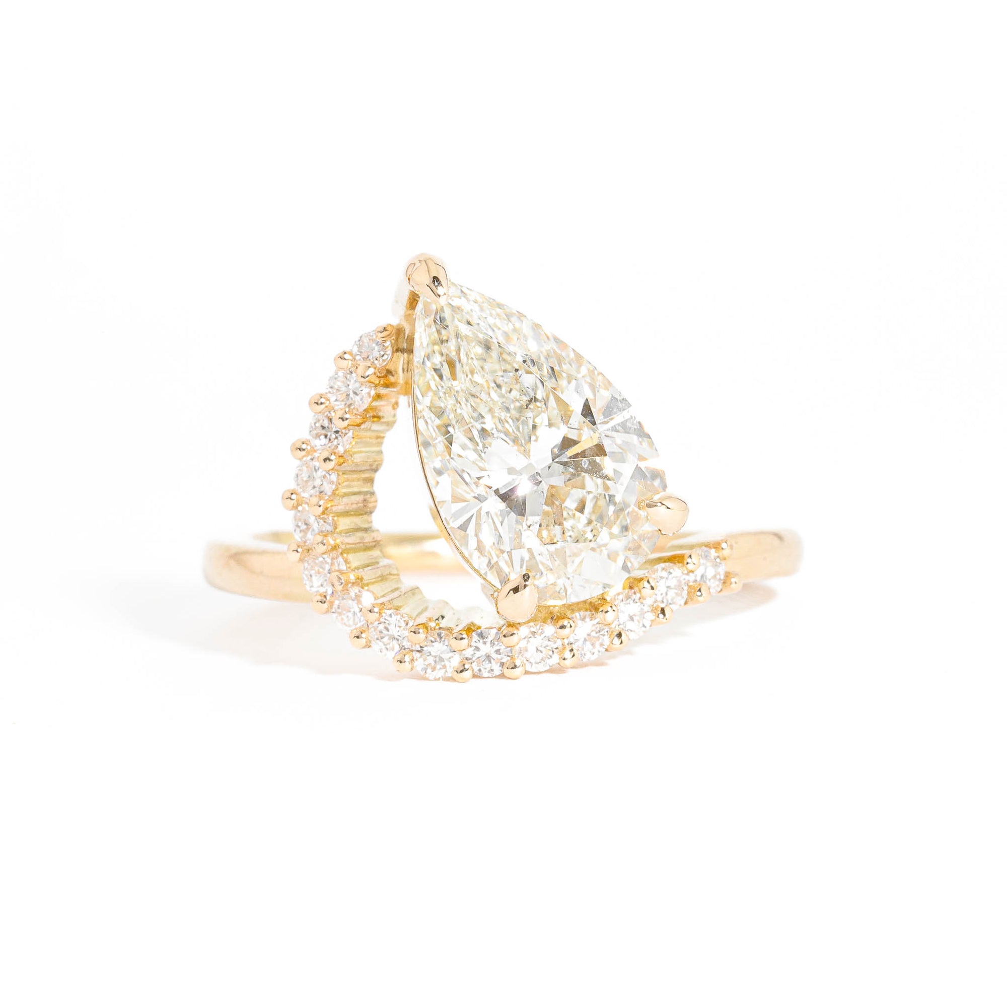Pear Cut Diamond with an Arch of Thirteen Round Brilliant Cut Diamonds in 18 Carat Yellow Gold