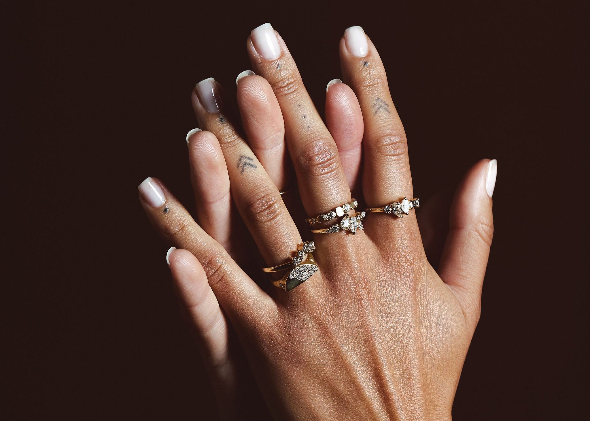 gold diamond rings on hand