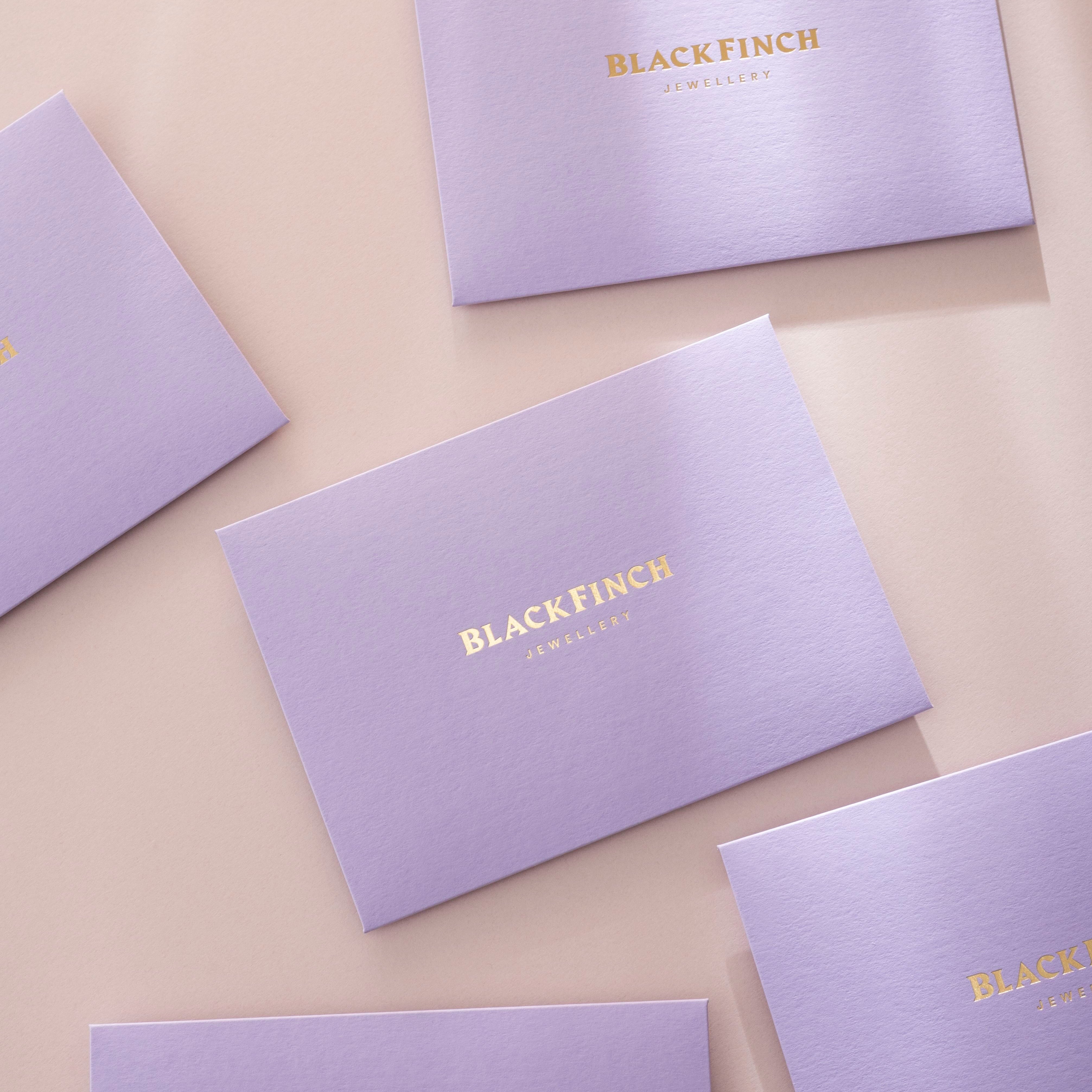Lilac black Finch branded envelopes