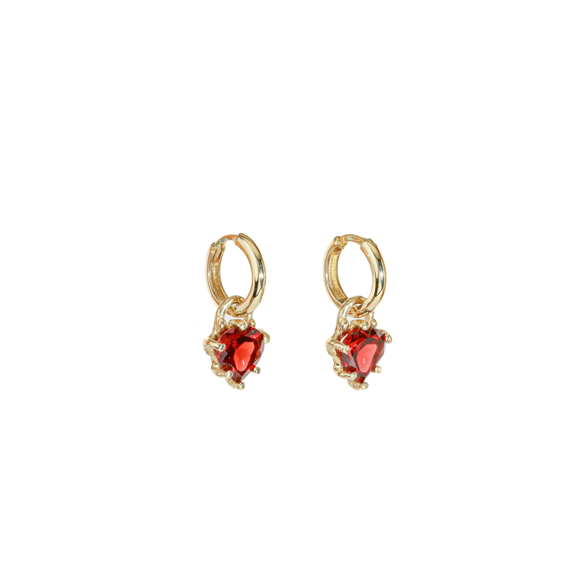 Gold hoop earrings with red heart-shaped garnet on a white background