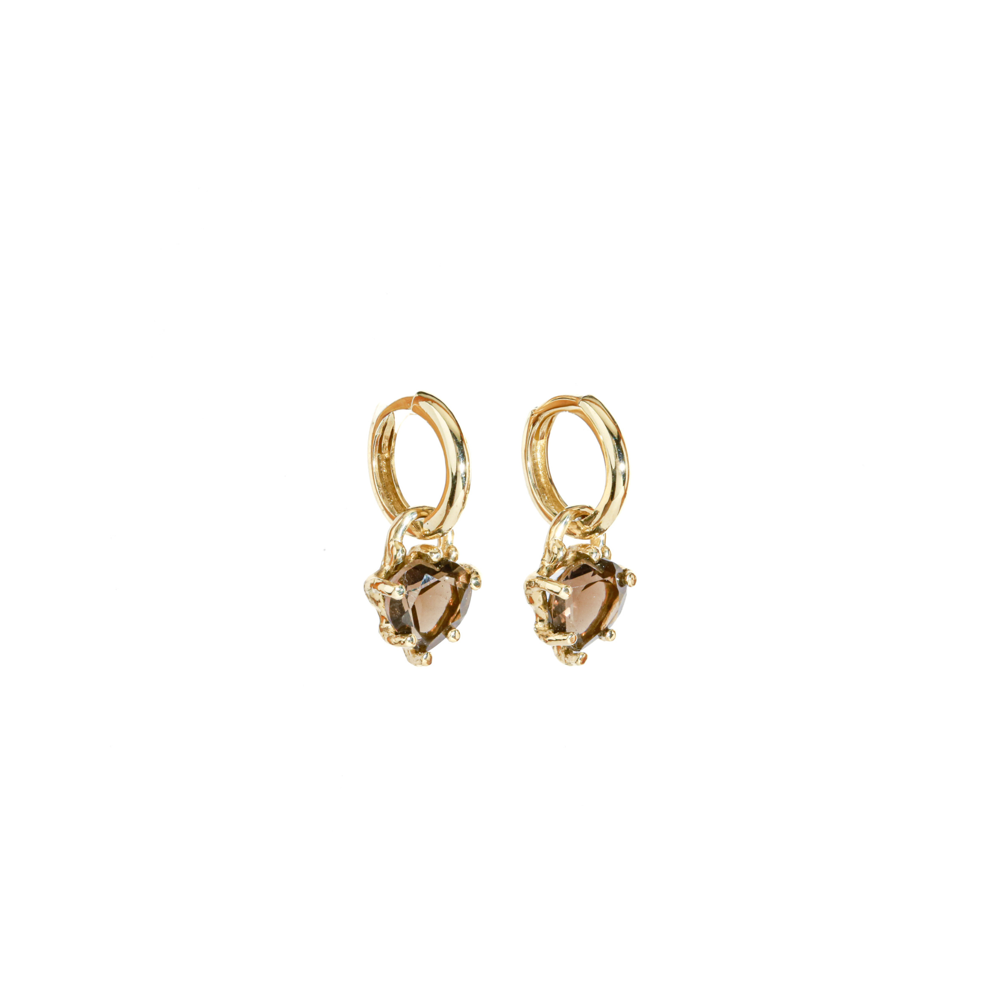 Gold hoop earrings with brown heart-shaped quartz on a white background