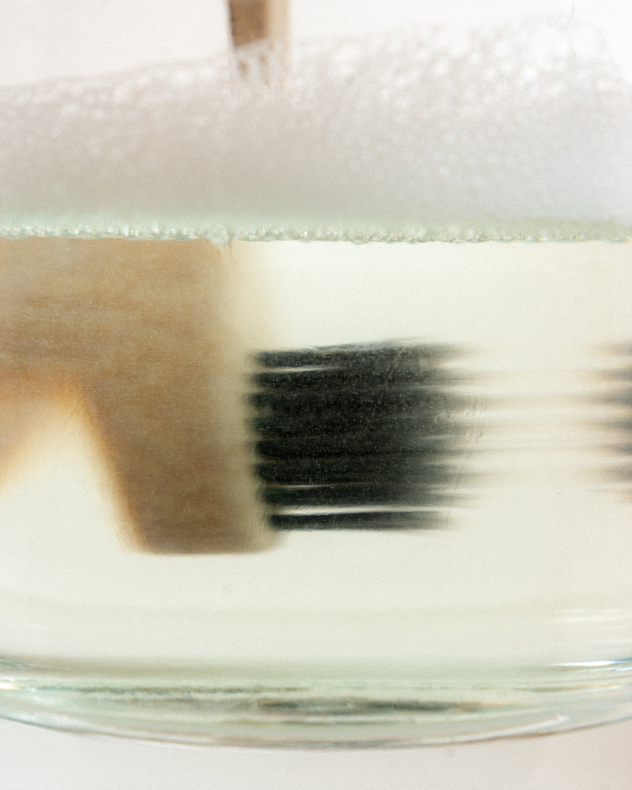 toothbrush in soapy water