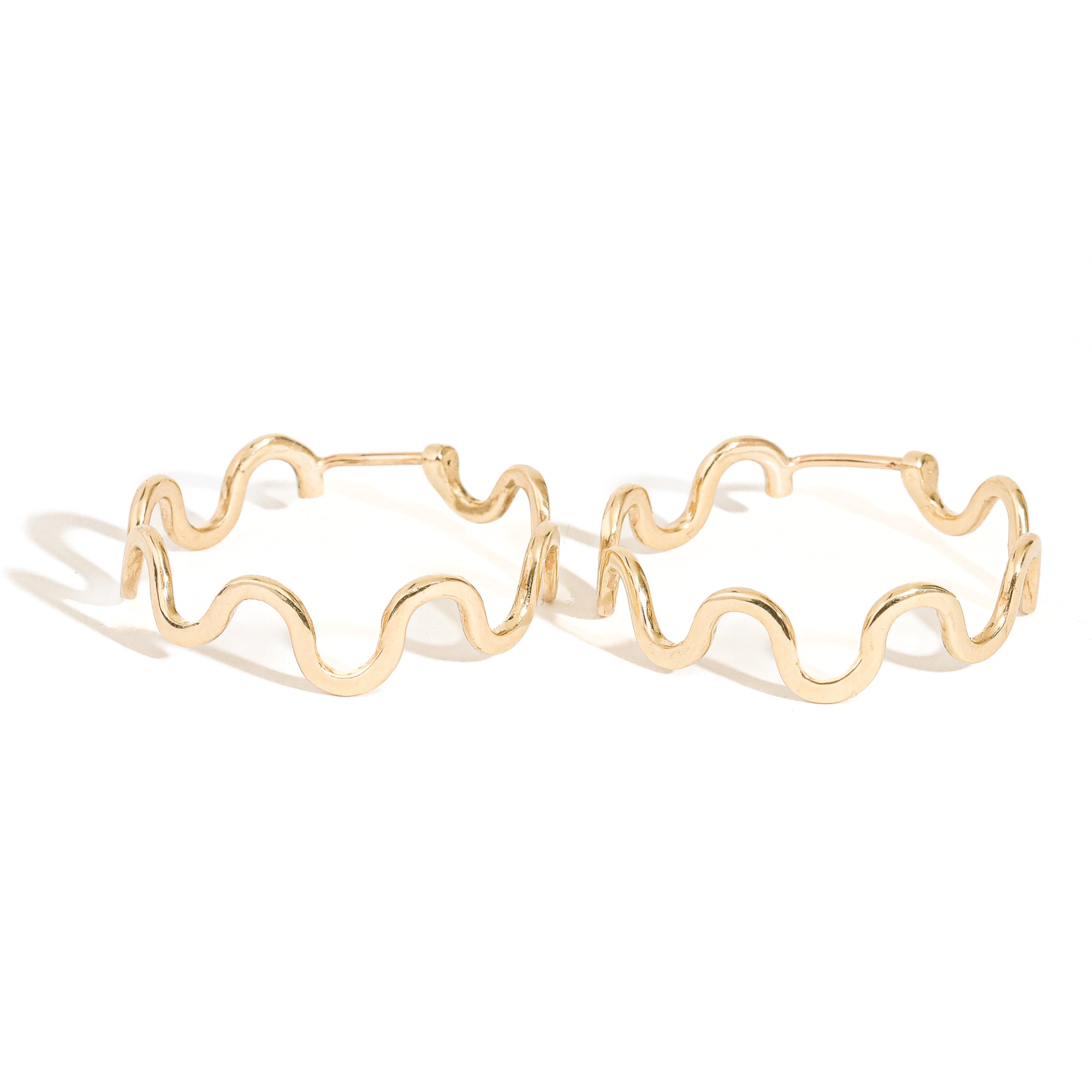 contemporary gold hoop earrings with ripple structure