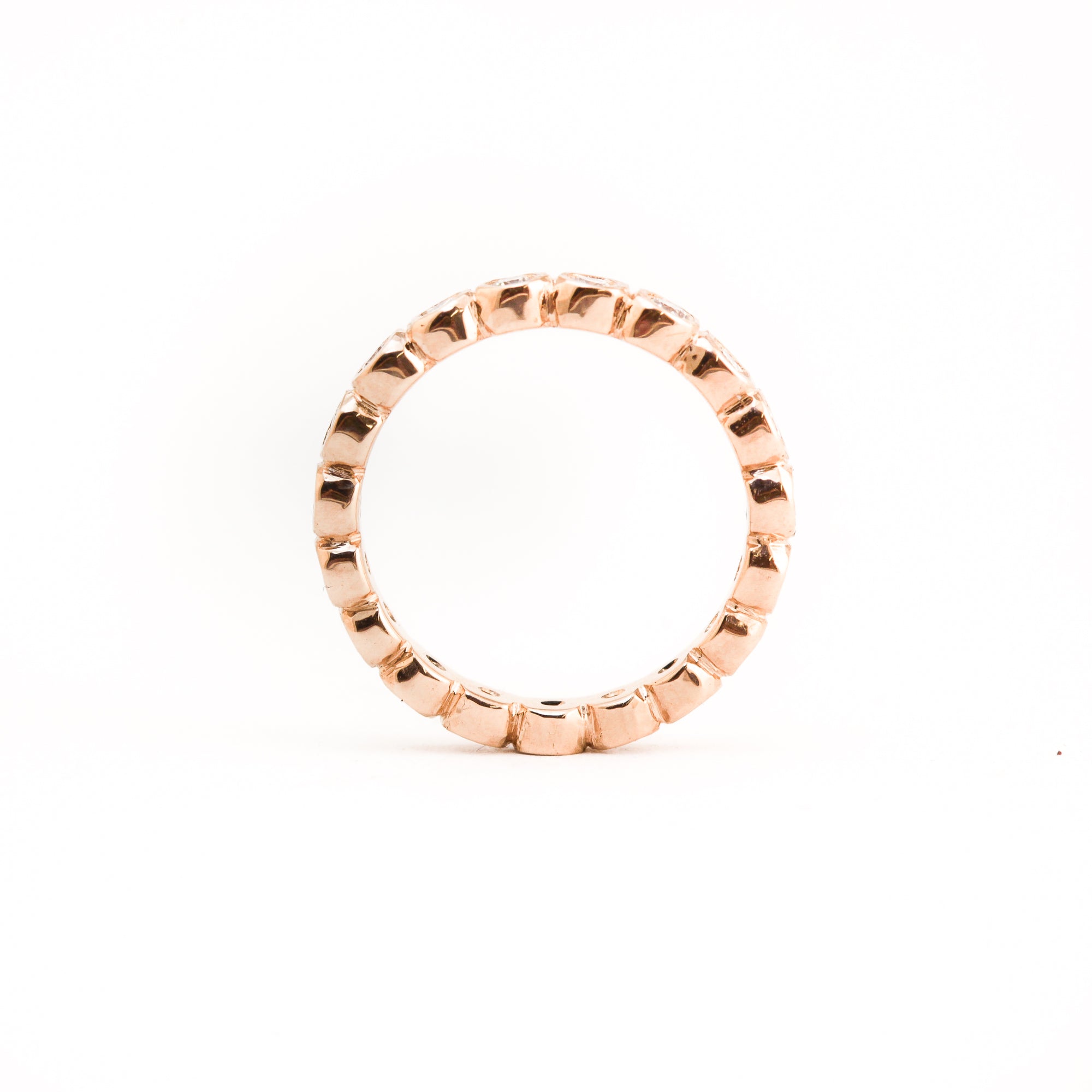 Bespoke 18 carat rose gold eternity ring, set with 23 round brilliant cut white diamonds.