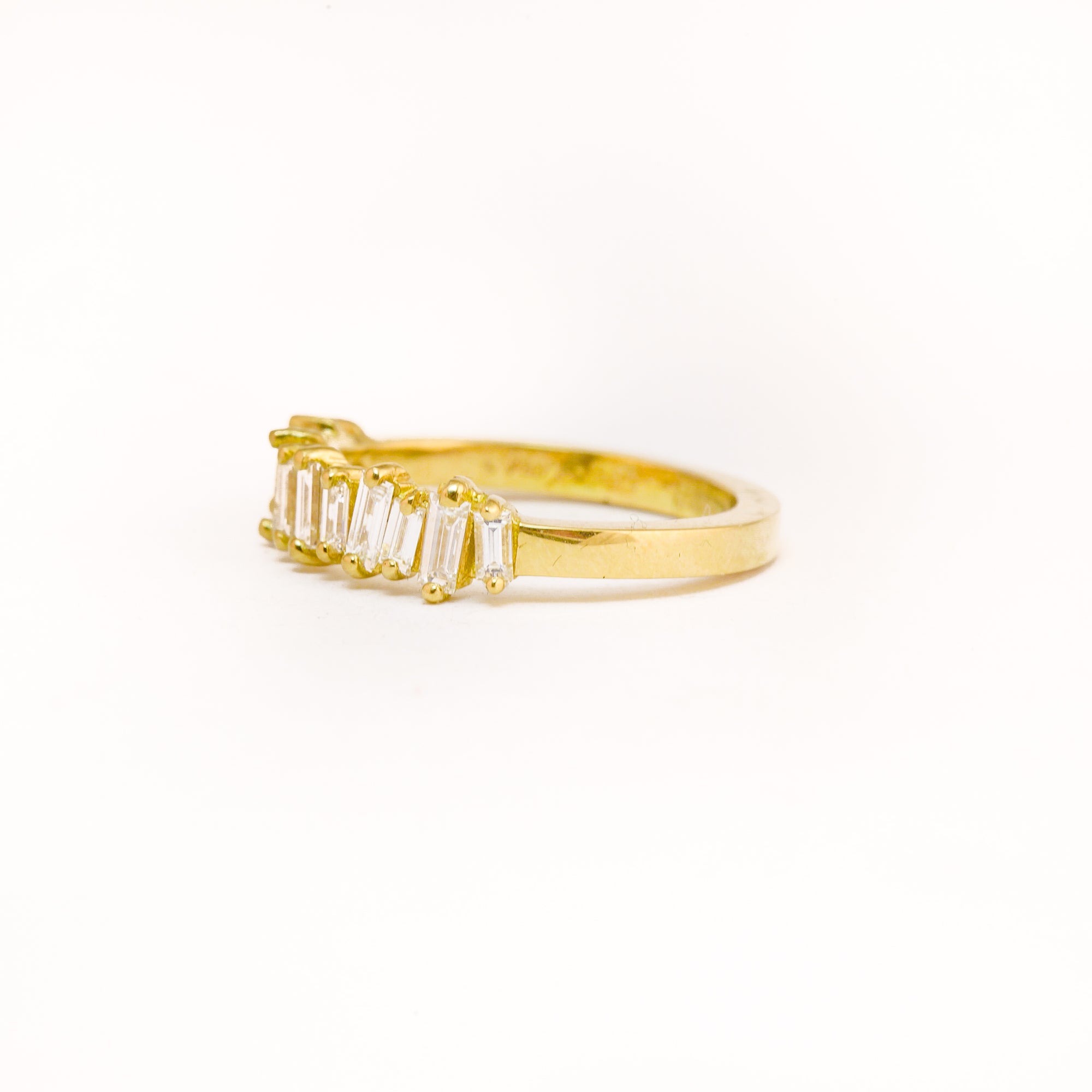 Made in Melbourne, bespoke line up of diamonds in row in an 18ct yellow band. 