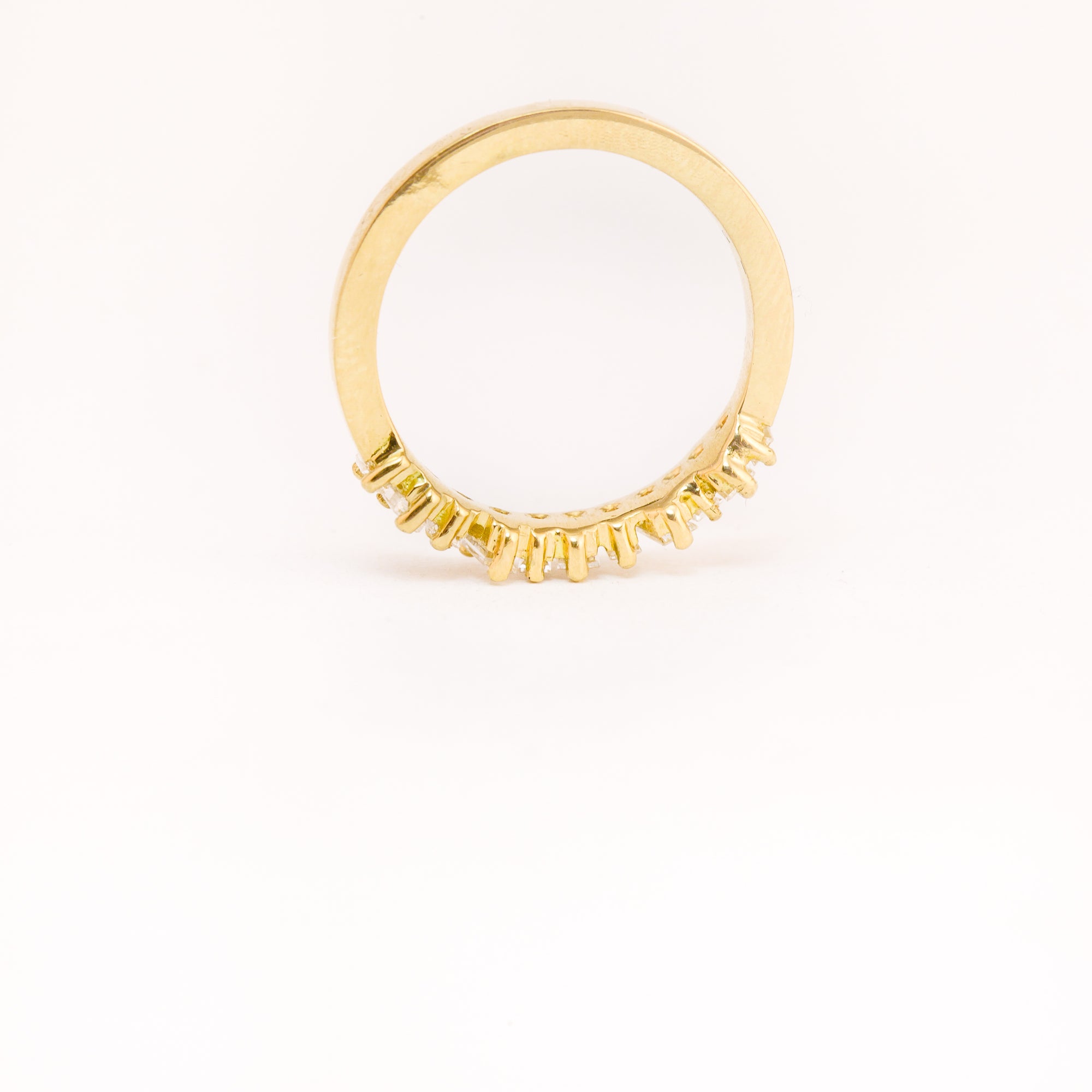 Made in Melbourne, bespoke line up of diamonds in row in an 18ct yellow band. 