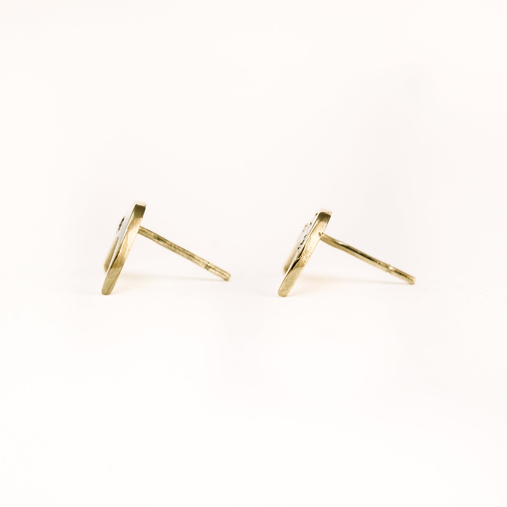 Handmade 9 carat yellow gold moon shaped studs, set with four round diamonds.