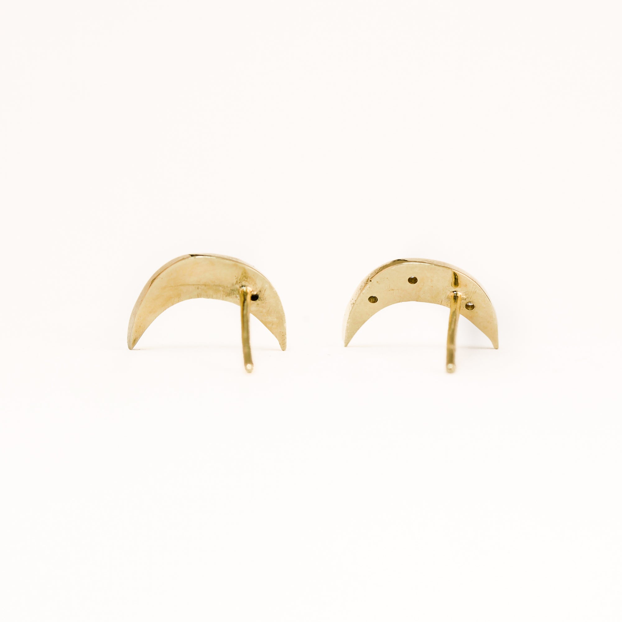Handmade 9 carat yellow gold moon shaped studs, set with four round diamonds.