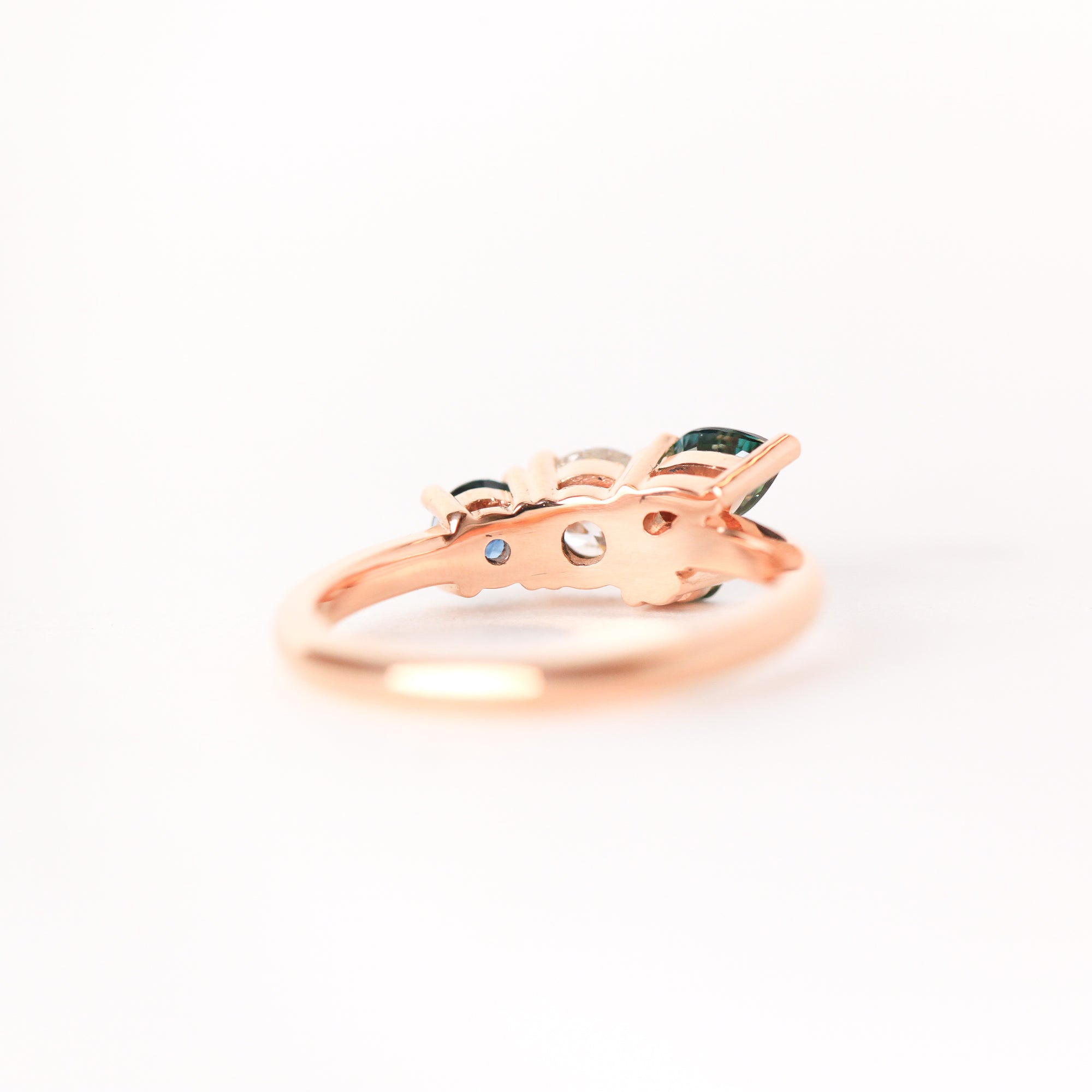 Cluster ring with central diamond, surrounded by sapphires in both round and pear shapes. Made in Melbourne. 