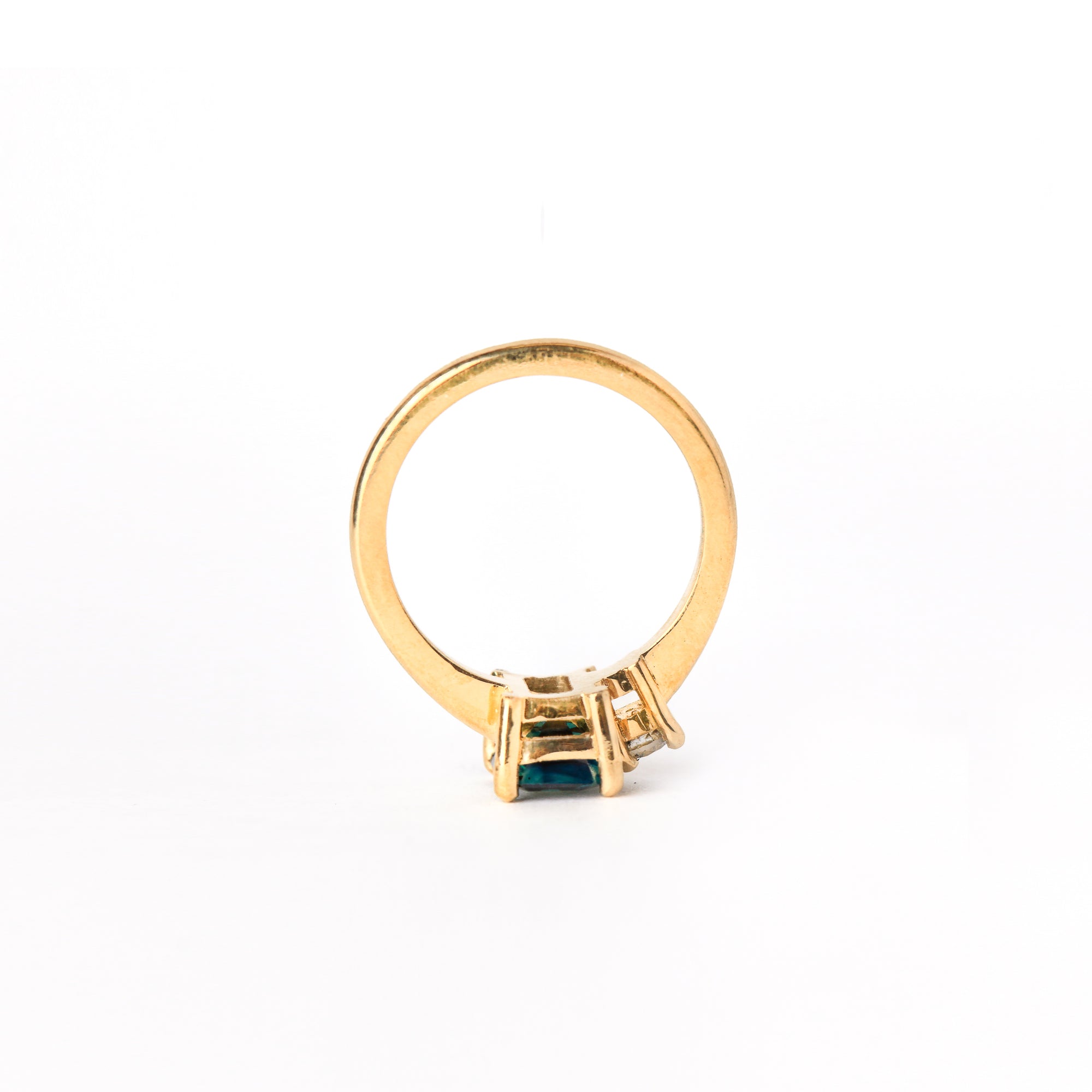 Ethically sourced emerald cut sapphire along side a white diamond. Crafted with recycled, refined gold. Made in Melbourne. 