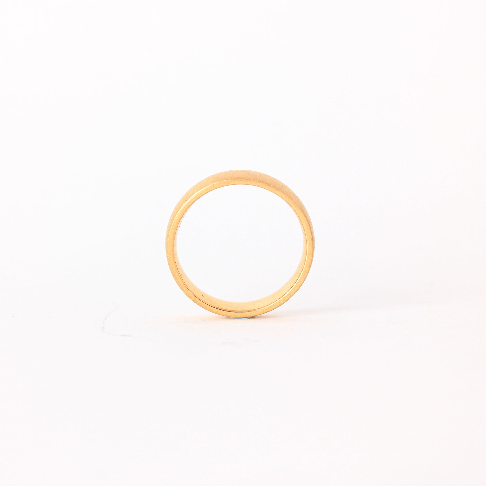 Classic 18 carat yellow gold wedding band with matte, brushed finish.