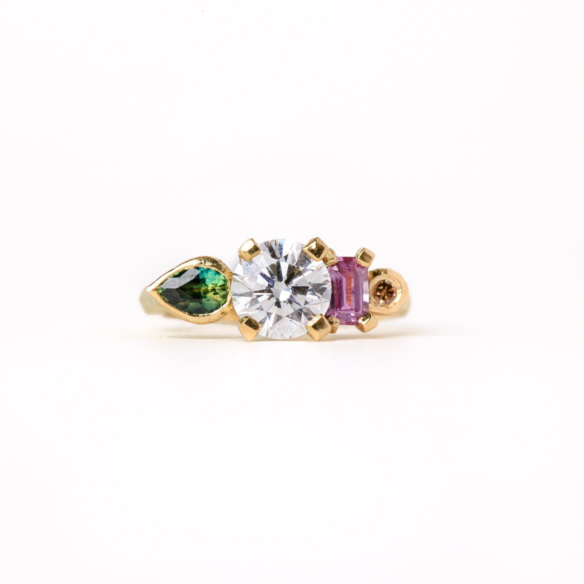 Ethically sourced pink and green Australian sapphires with a diamond centred. Featured here in 18ct yellow gold.