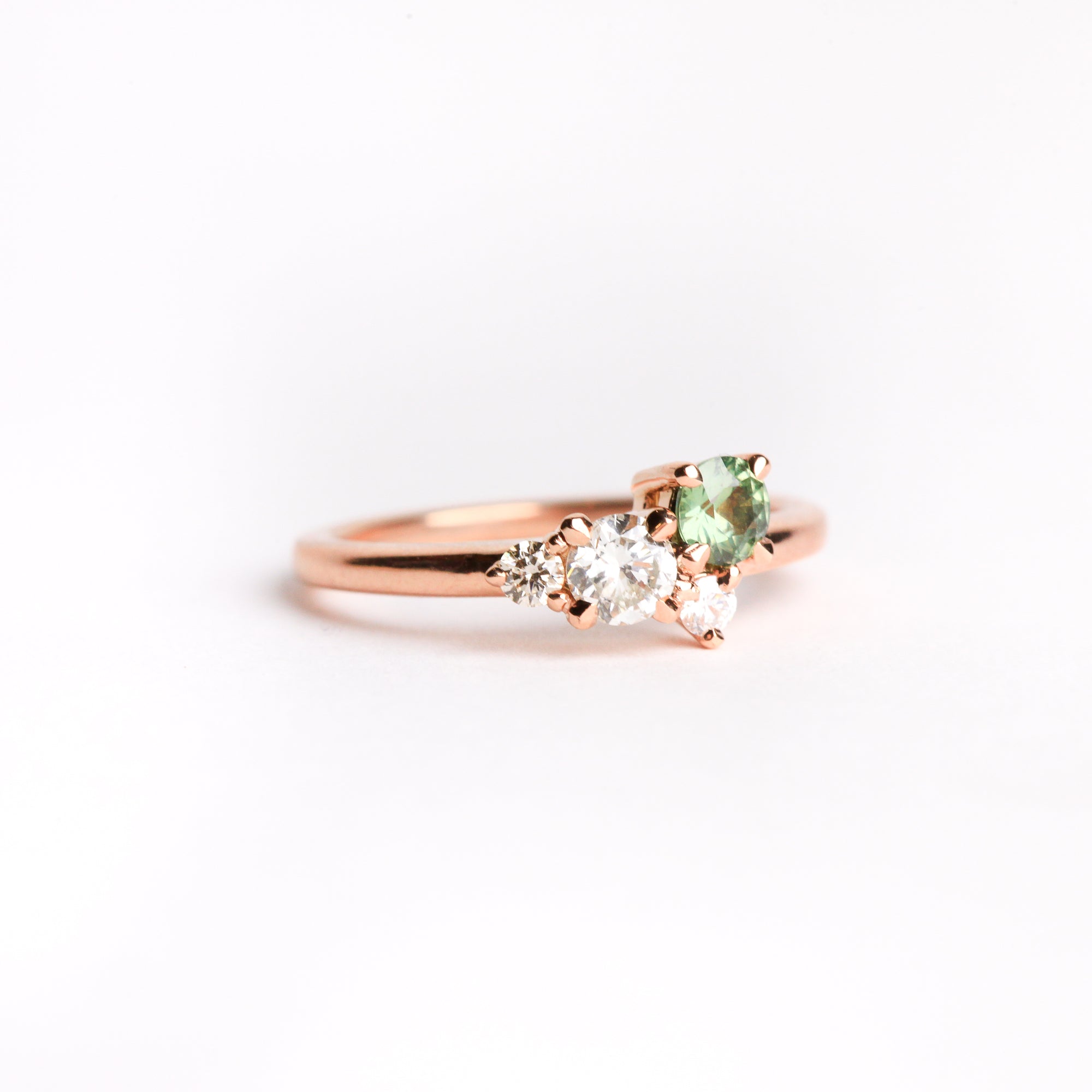 Ethically sourced ethically sourced Australian green sapphire with white and champagne diamond ring with recycled refined 18ct Rose Gold. Bespoke and Handmade by Black Finch Jewellery in Melbourne