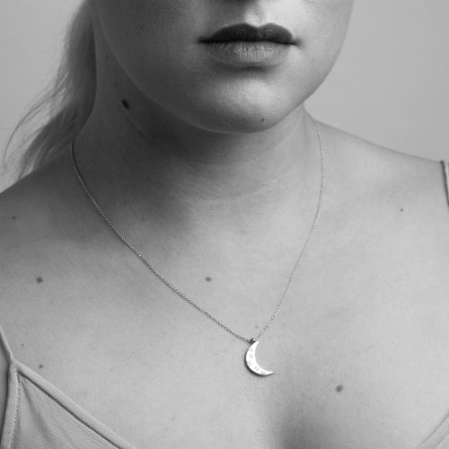 Made in Melbourne crescent moon pendant in 9ct yellow gold with diamonds star set. Worn by model. 