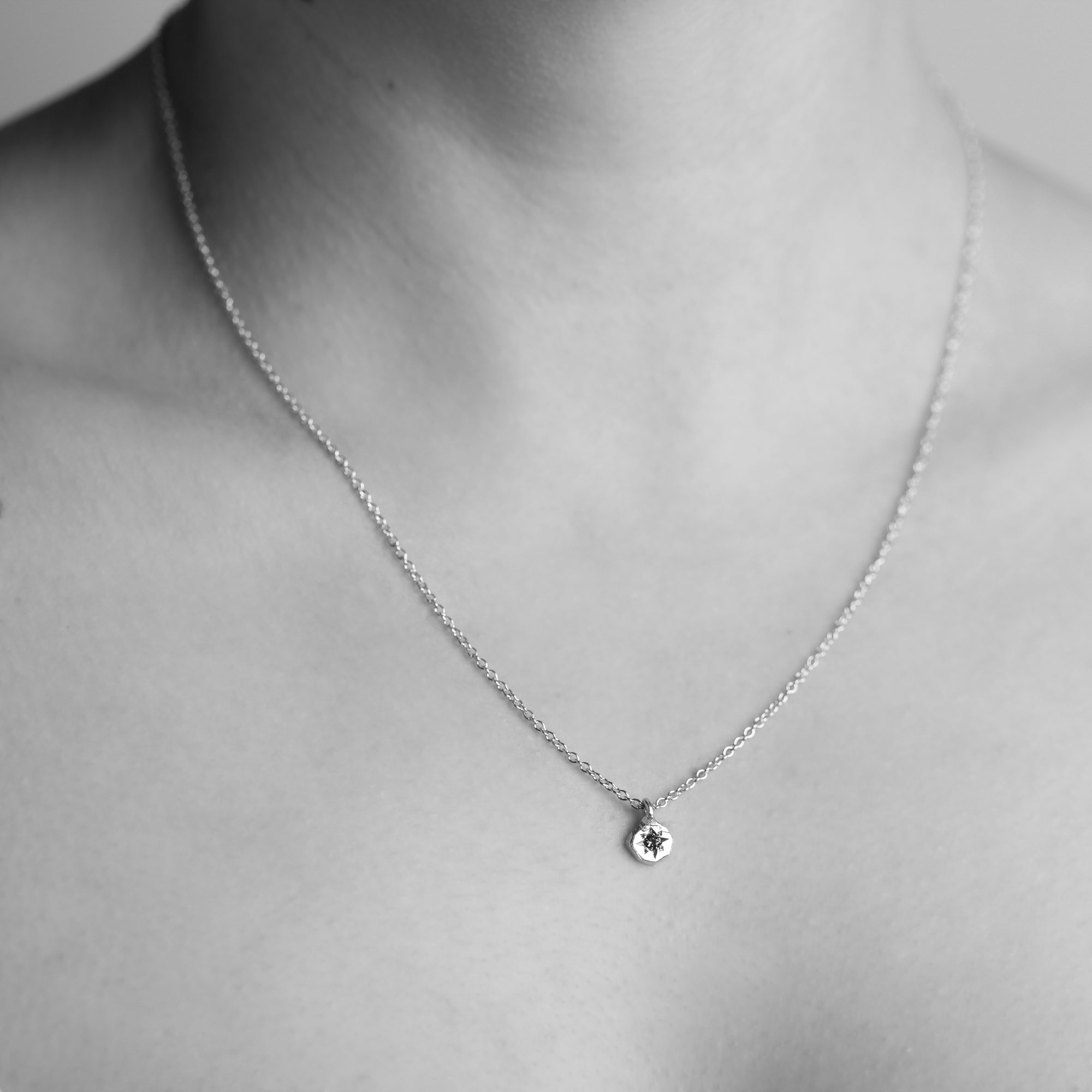 Dainty pendant crafted in 9ct yellow gold with recycled, refined gold. Featuring an ethically sourced Australian teal sapphire on an 9ct gold chain. Shown on model. 