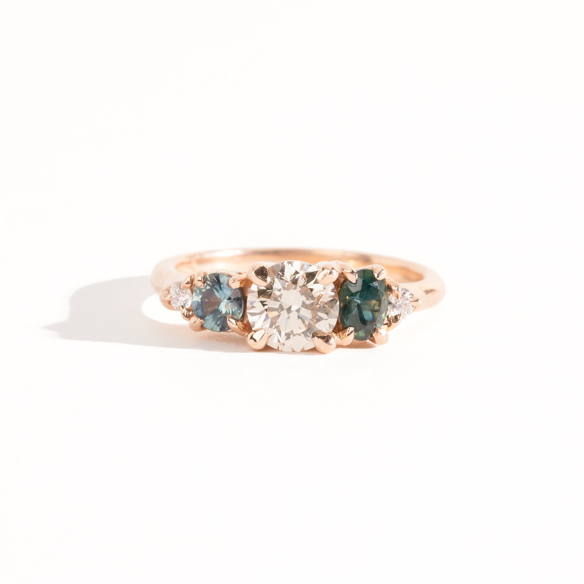Handmade, bespoke Diamond and ethically sourced Australian sapphire five stone cluster ring in 14ct recycled refined rose gold
